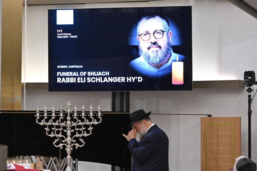 Alleged Bondi gunman charged with 59 offences as first funerals held