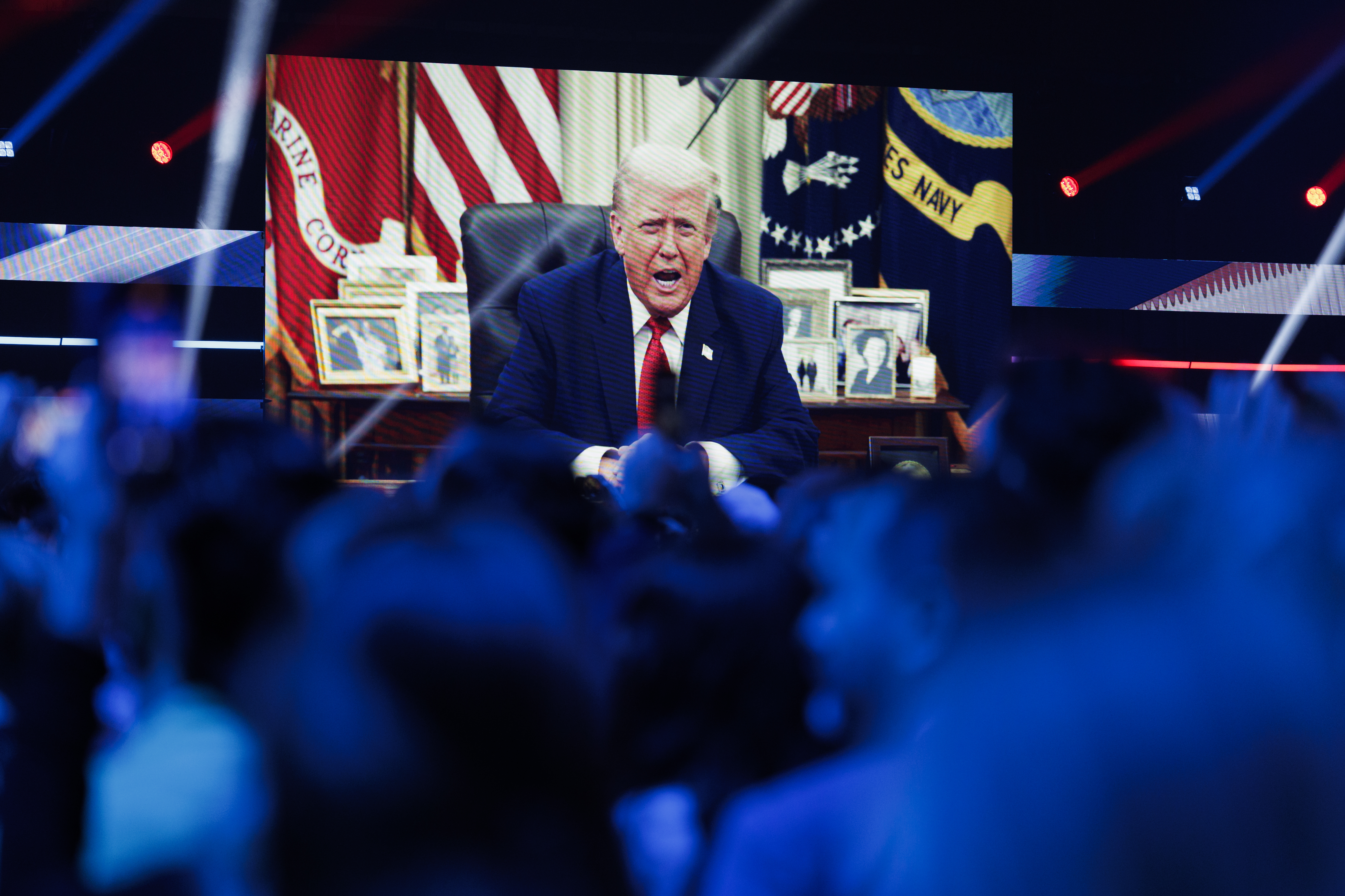 A video message from President Donald Trump is played on the final day of Turning Point USA's annual AmericaFest conference at the Phoenix Convention Center on December 21, 2025 in Phoenix, Arizona.