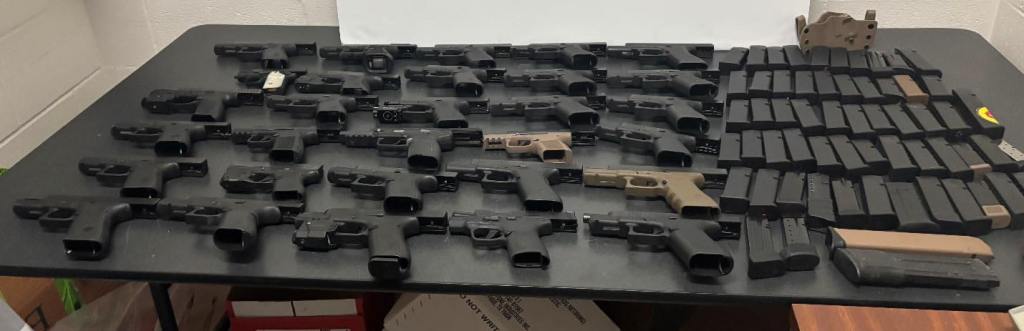 During the inspection, special agents discovered 30 handguns, including a 5.7-caliber FN Herstal, 60 magazines and one speed loader concealed inside the vehicle’s spare tire.
