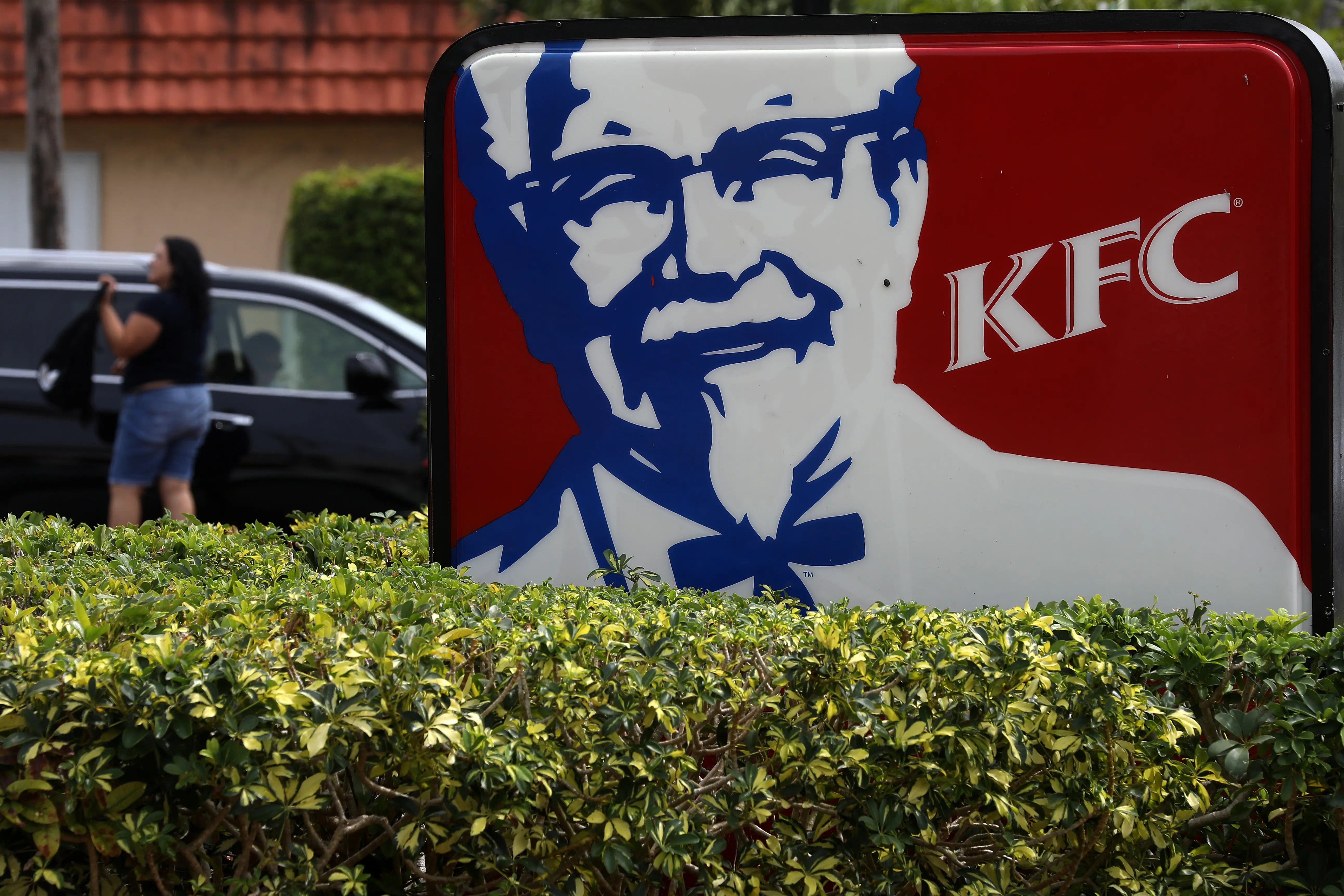 FILE PHOTO: A Kentucky Fried Chicken (KFC) logo is pictured on a sign in North Miami Beach, Florida, U.S. April 6, 2017.   REUTERS/Carlo Allegri