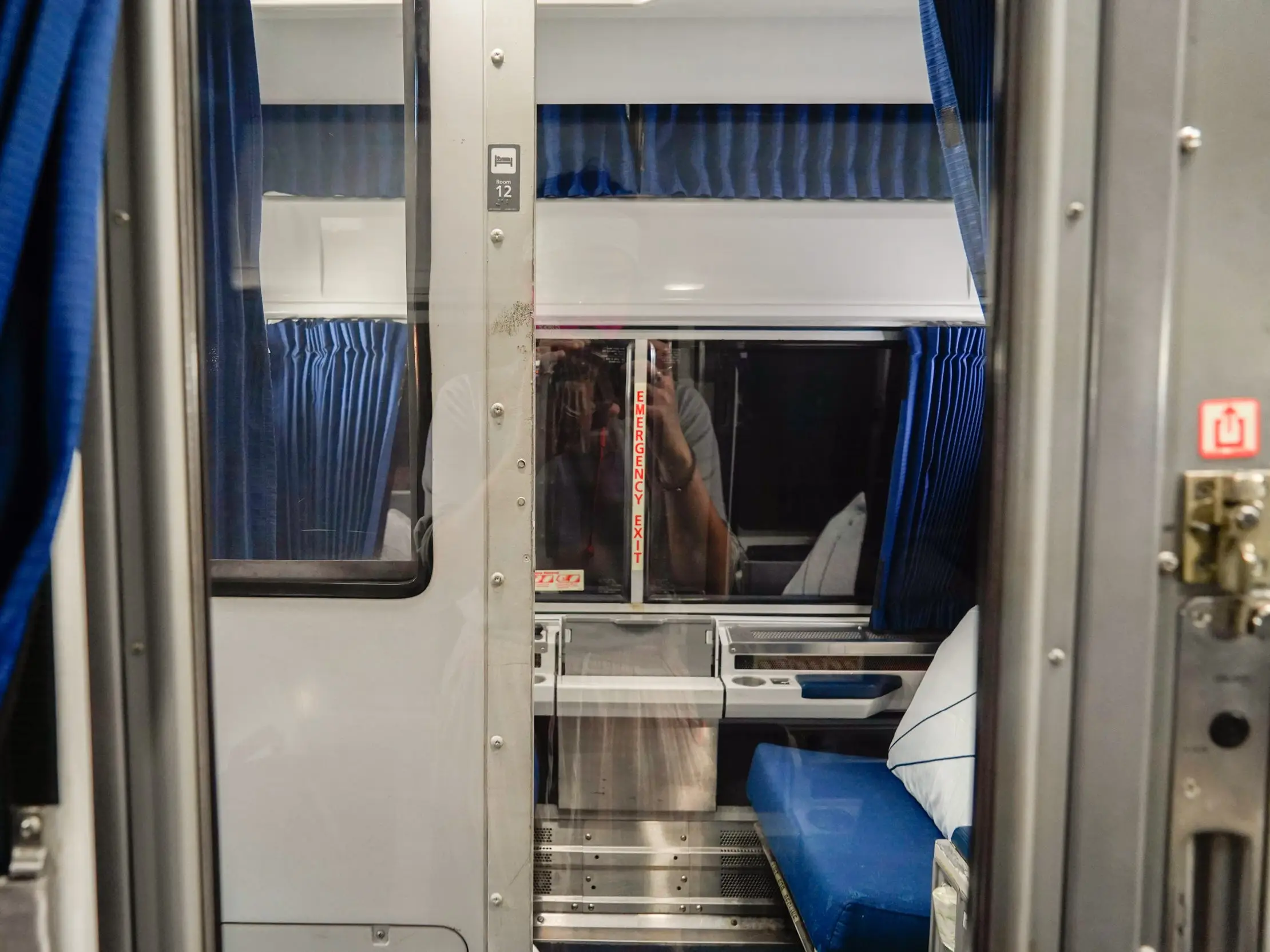 A view of an empty roomette across from the author's on an Amtrak.