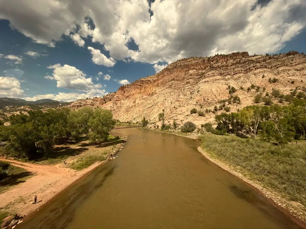 views of the Colorado river form the right-side window of an amtrak train