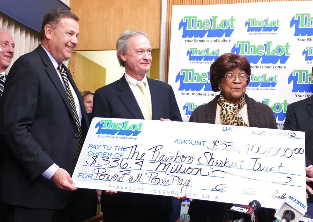 Louise White, right, from Newport, Rhode Island, is presented a check for $336 million