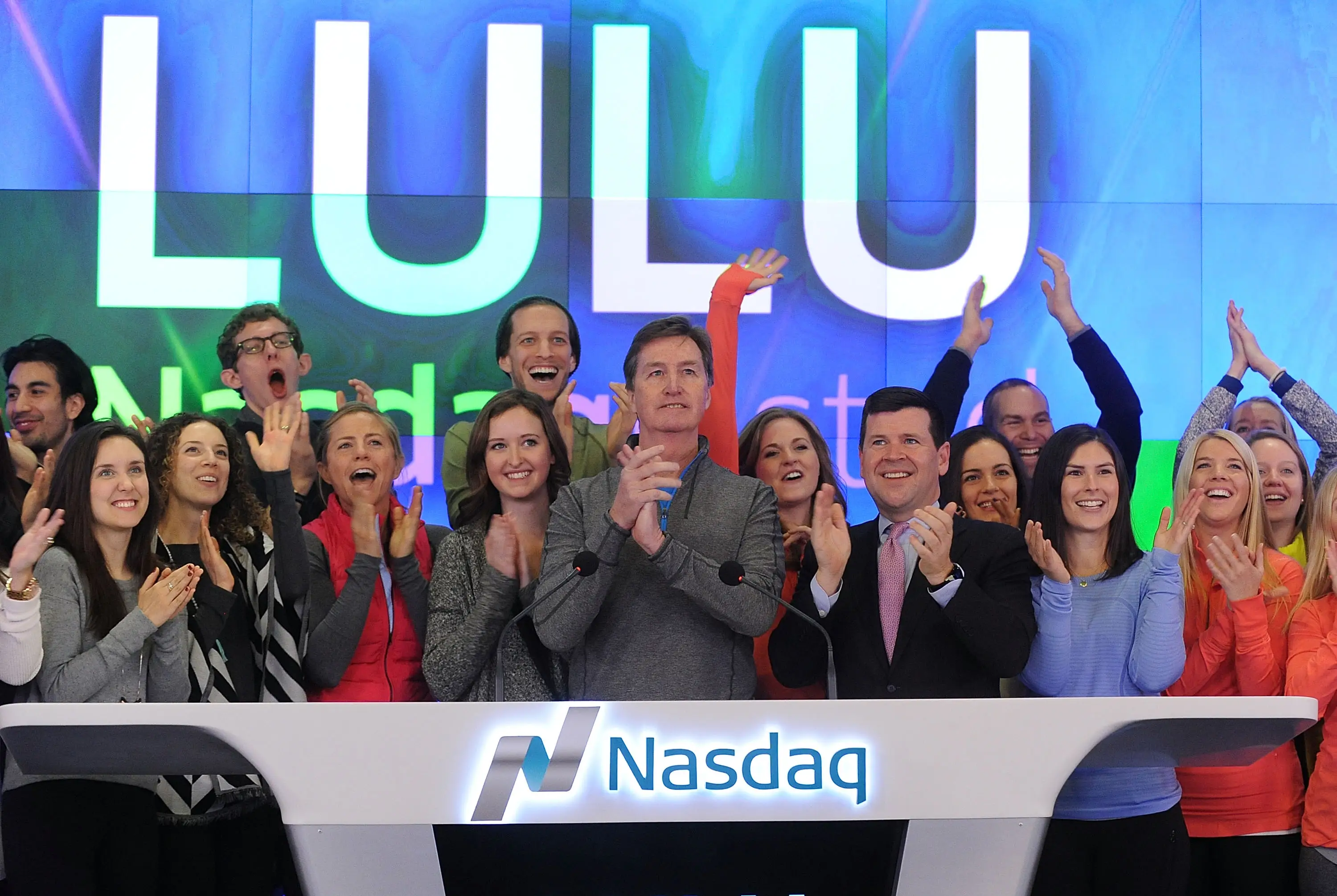 crowd of people celebrate Lululemon IPO at Nasdaq