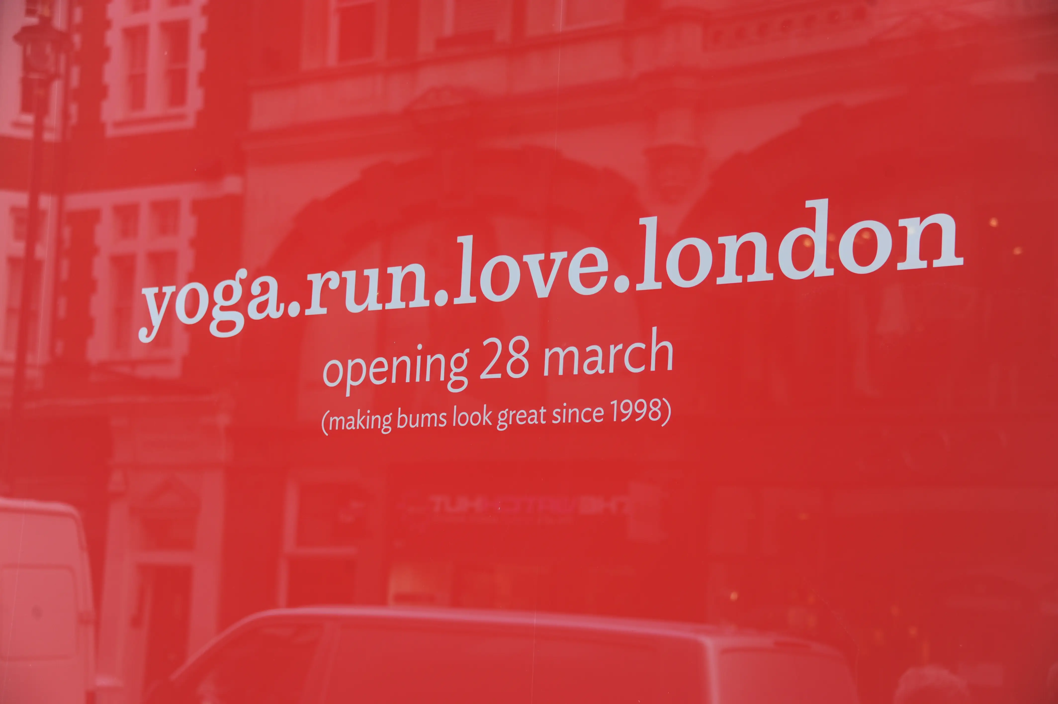 a window is covered by branded Lululemon sign