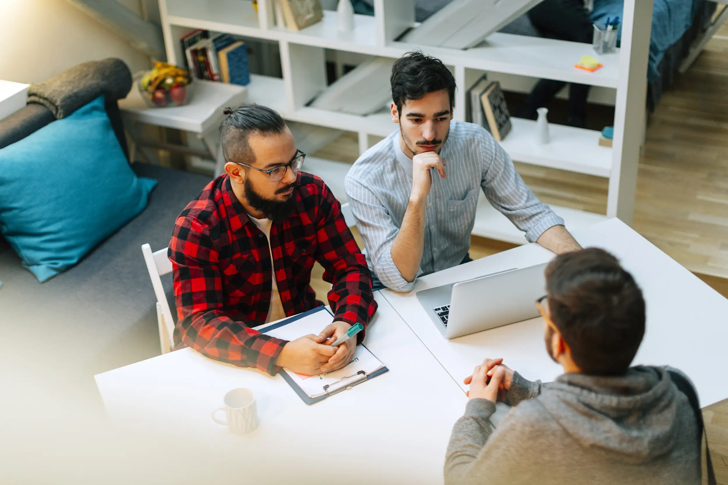 Photo illustration of job interview with software developers.