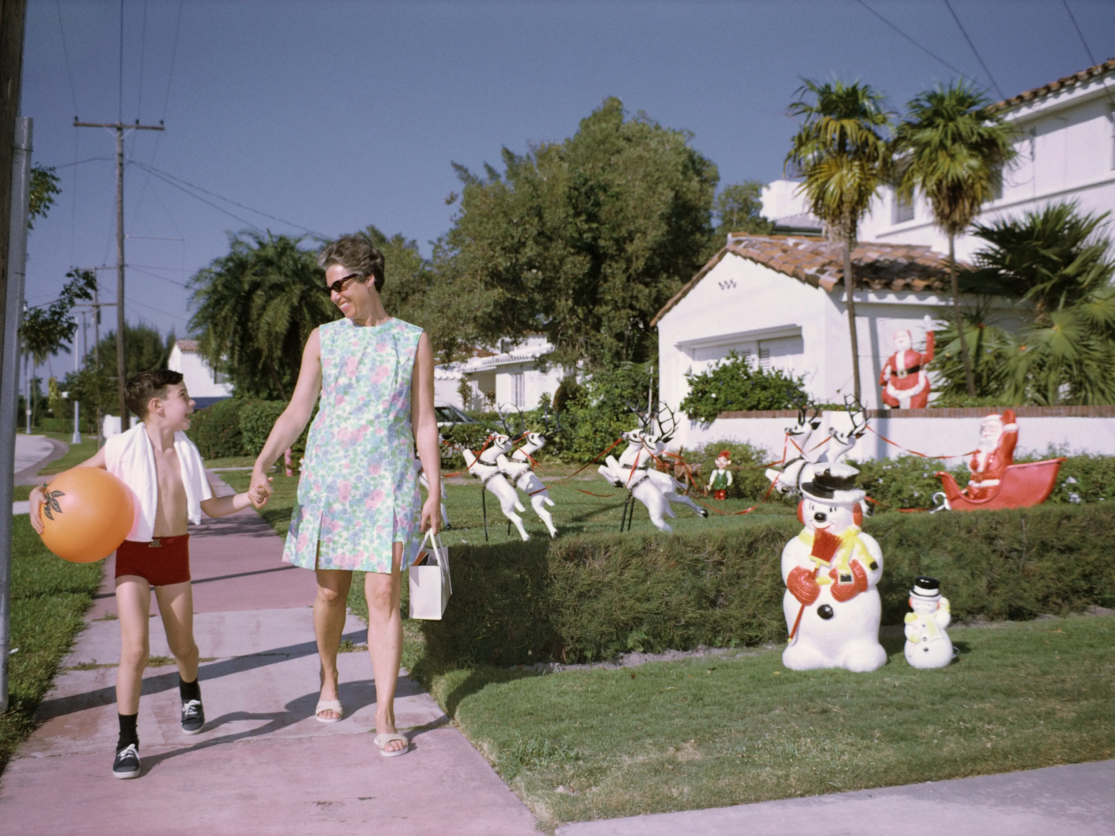 A residential street decorated for Christmas in 1962