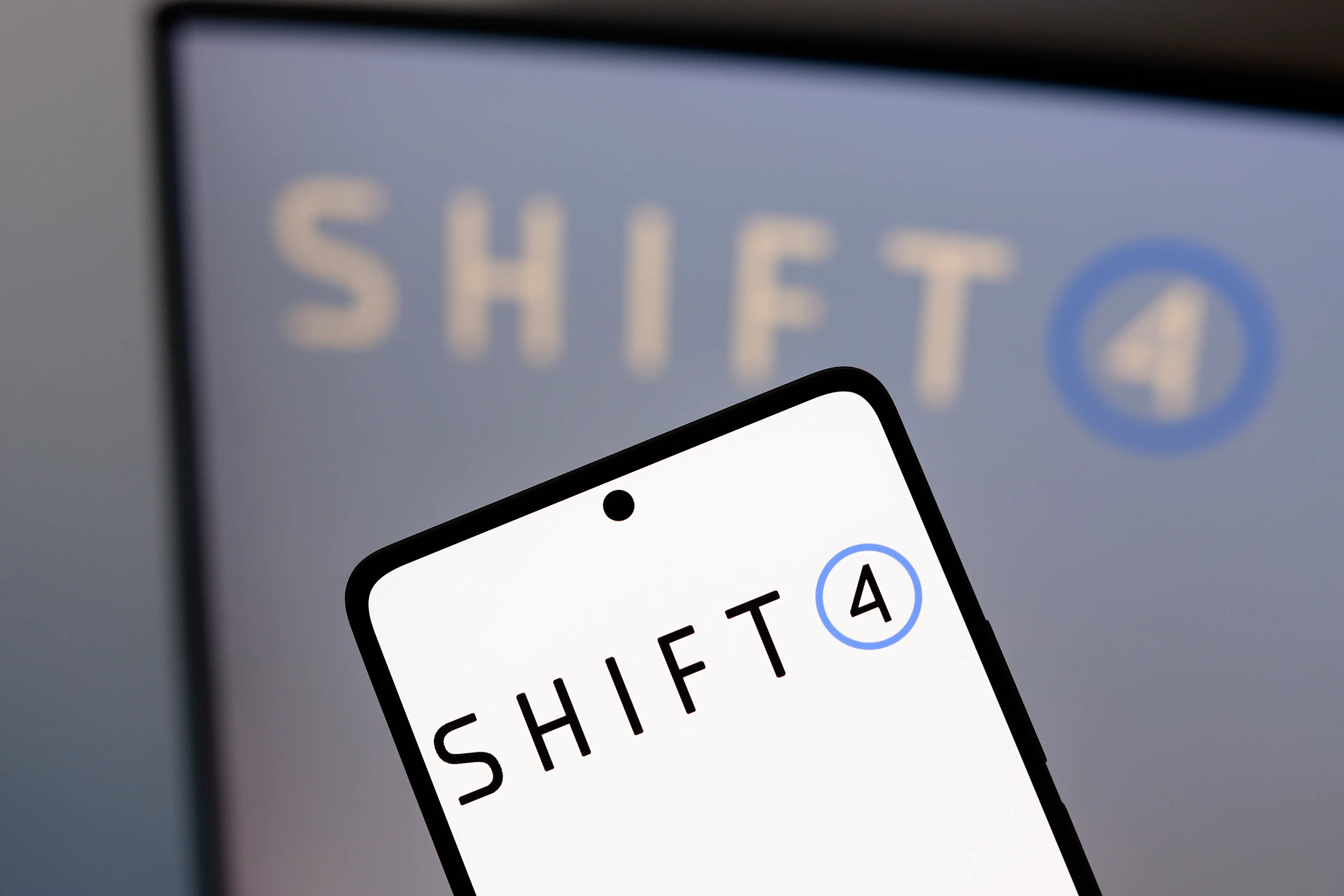 Shift 4 logo on phone screen