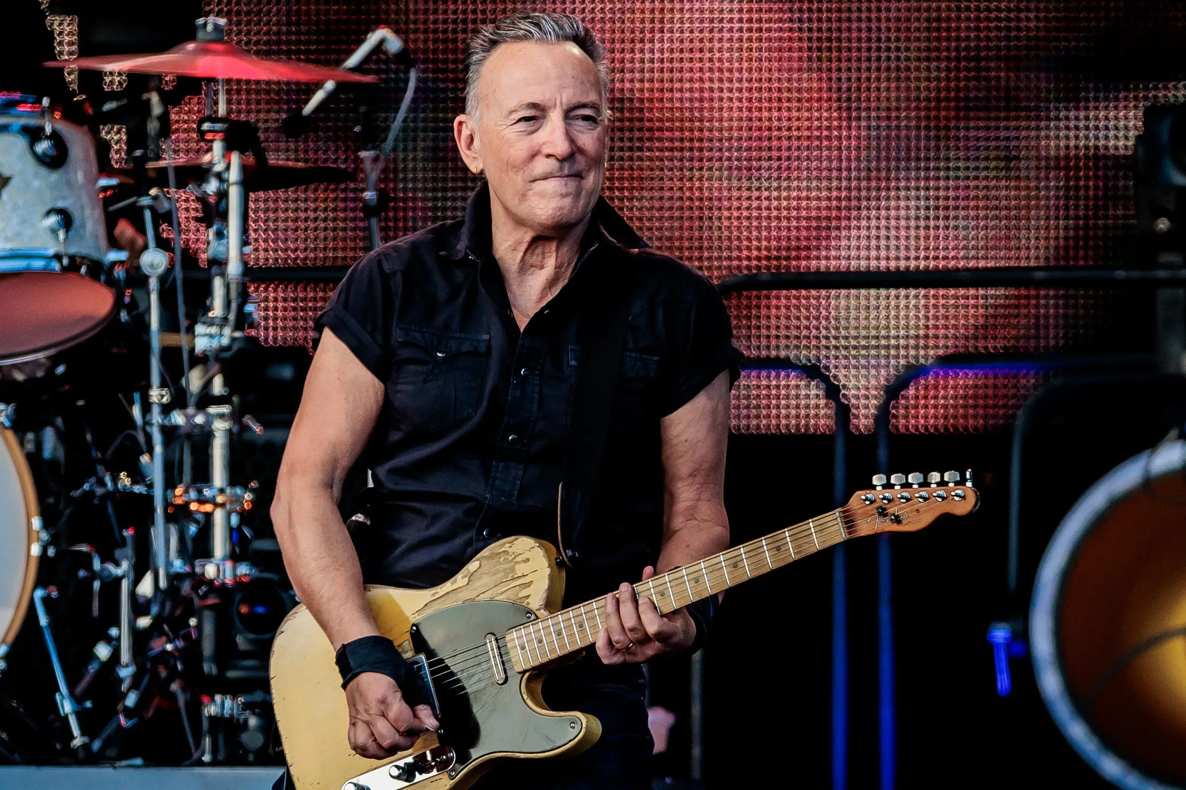 Bruce Springsteen playing guitar onstage