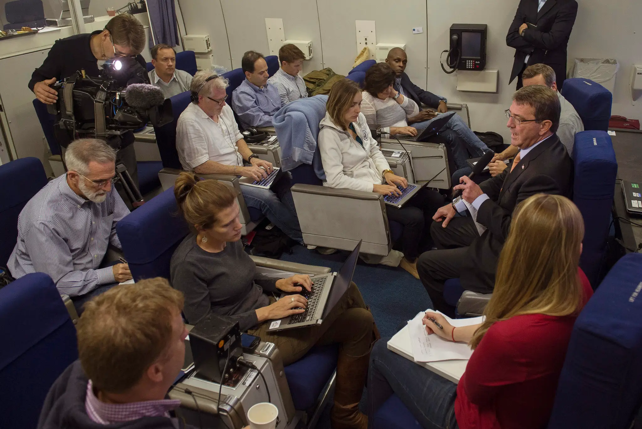 Secretary of Defense Ash Carter speaks with members of the media on board an E-4B aircraft.