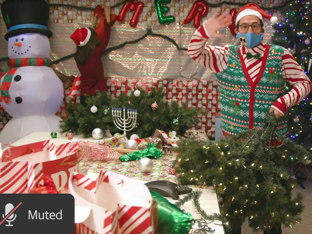 Jon Gray in front of a large display of holiday decorations.