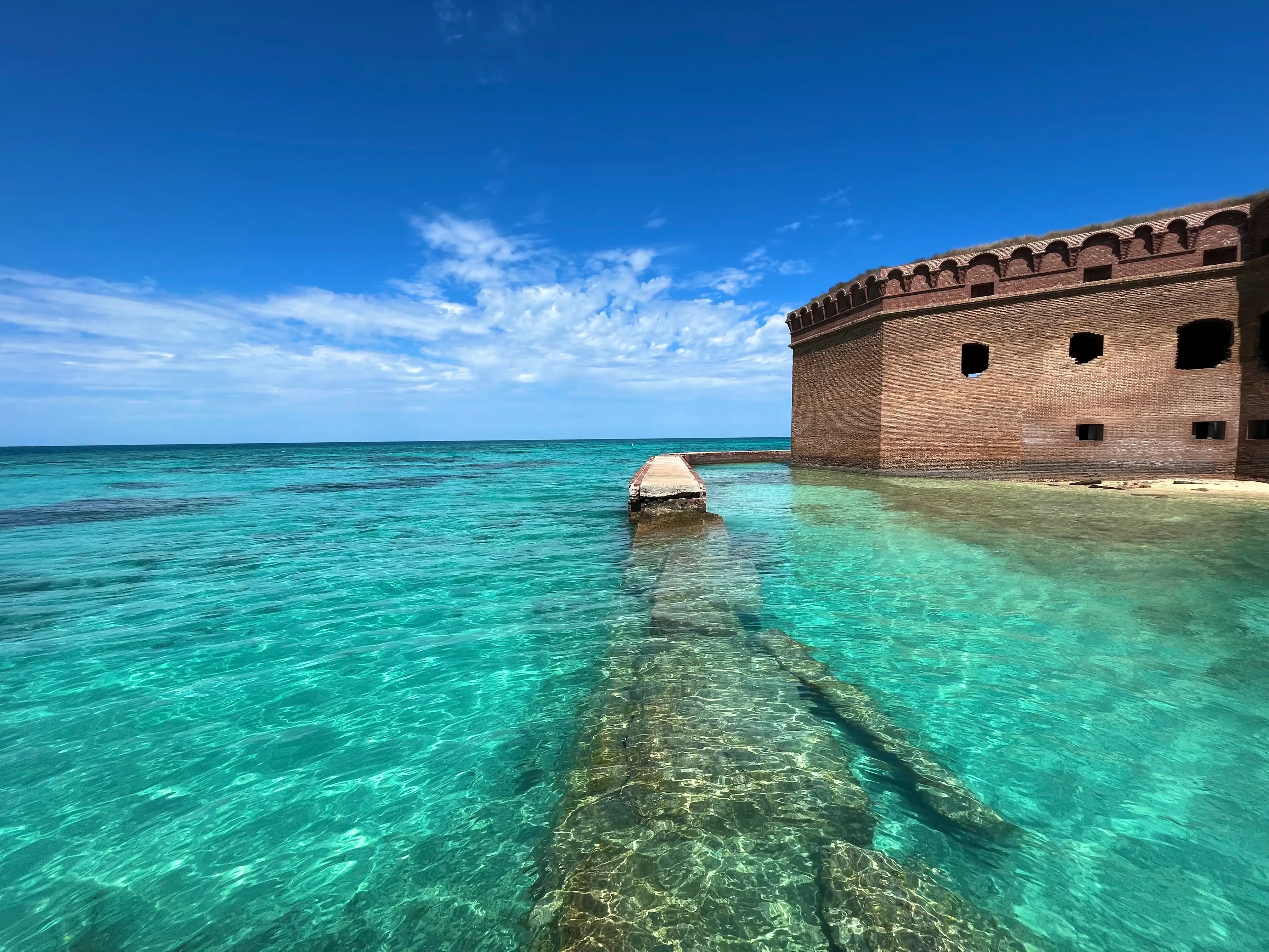 A fort surrounded by turquoise blue water in Dry Tortugas National Park.