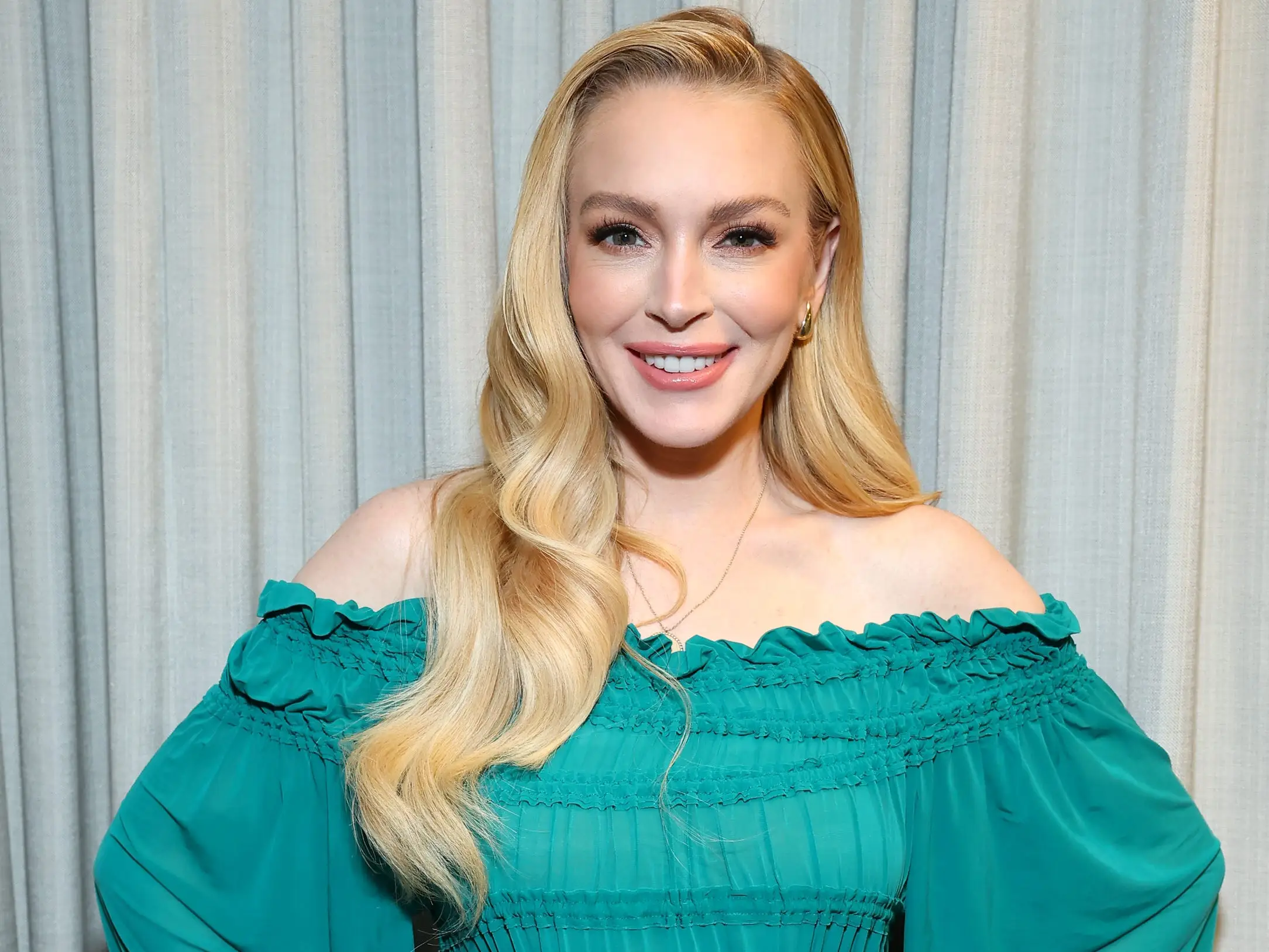 Lindsay Lohan in a gree dress