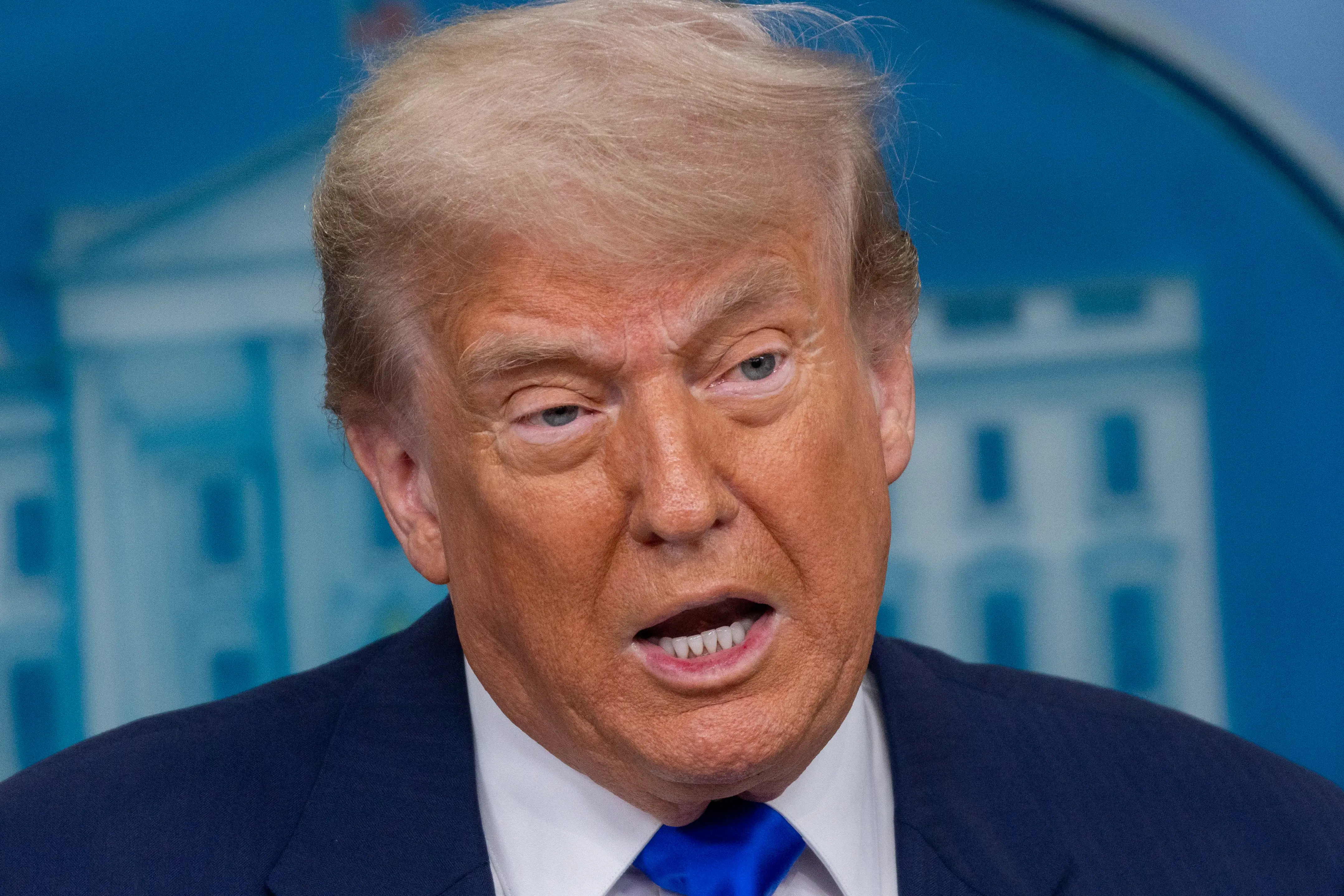President Donald Trump speaking at a press conference at the White House.