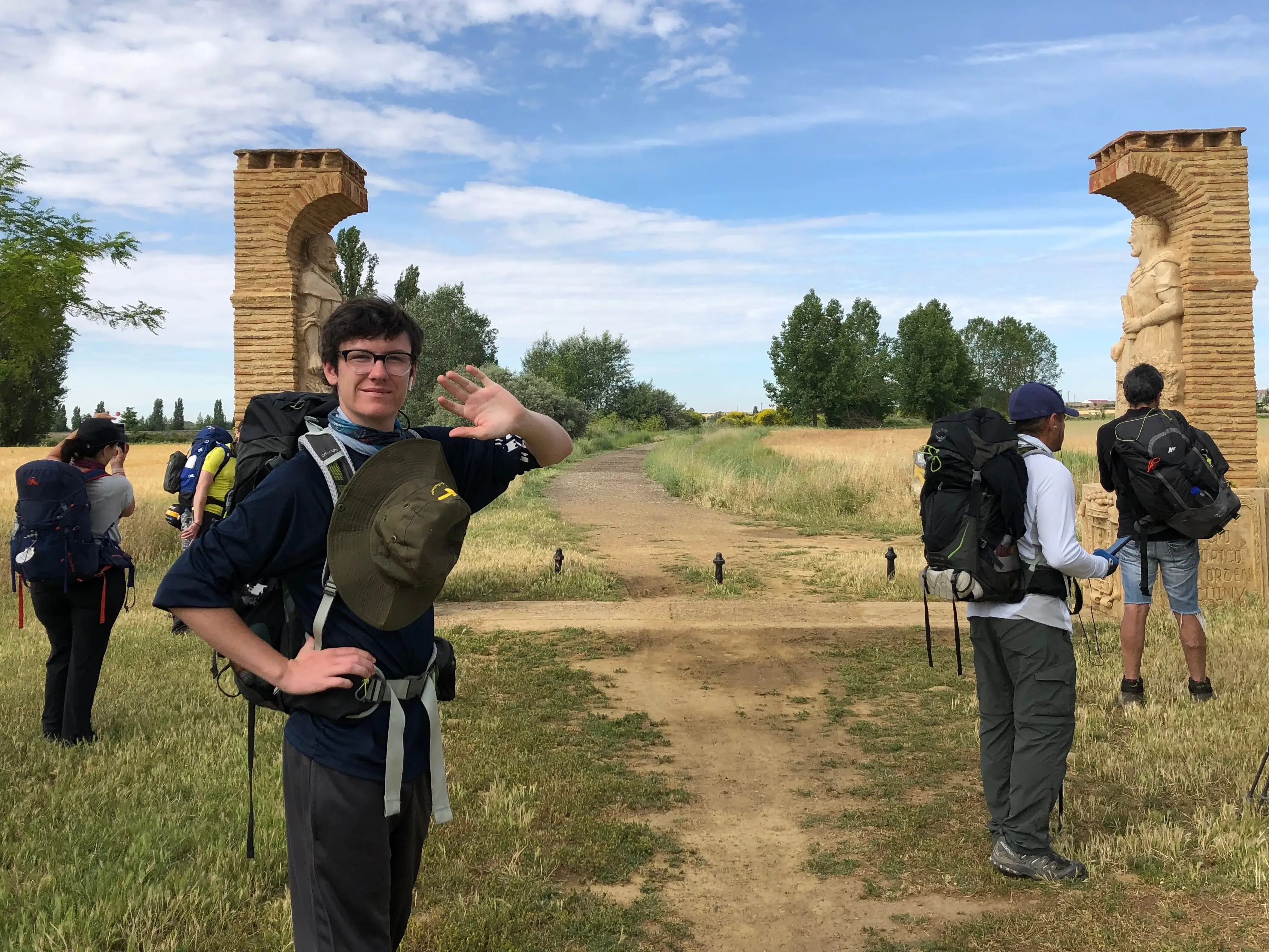 The author waving to the camera on his first Camino in 2019.