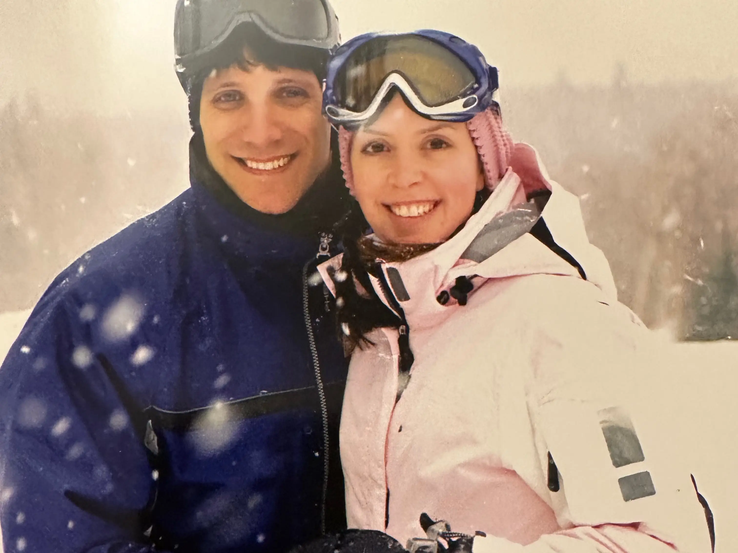 Couple posing for photos in the snow