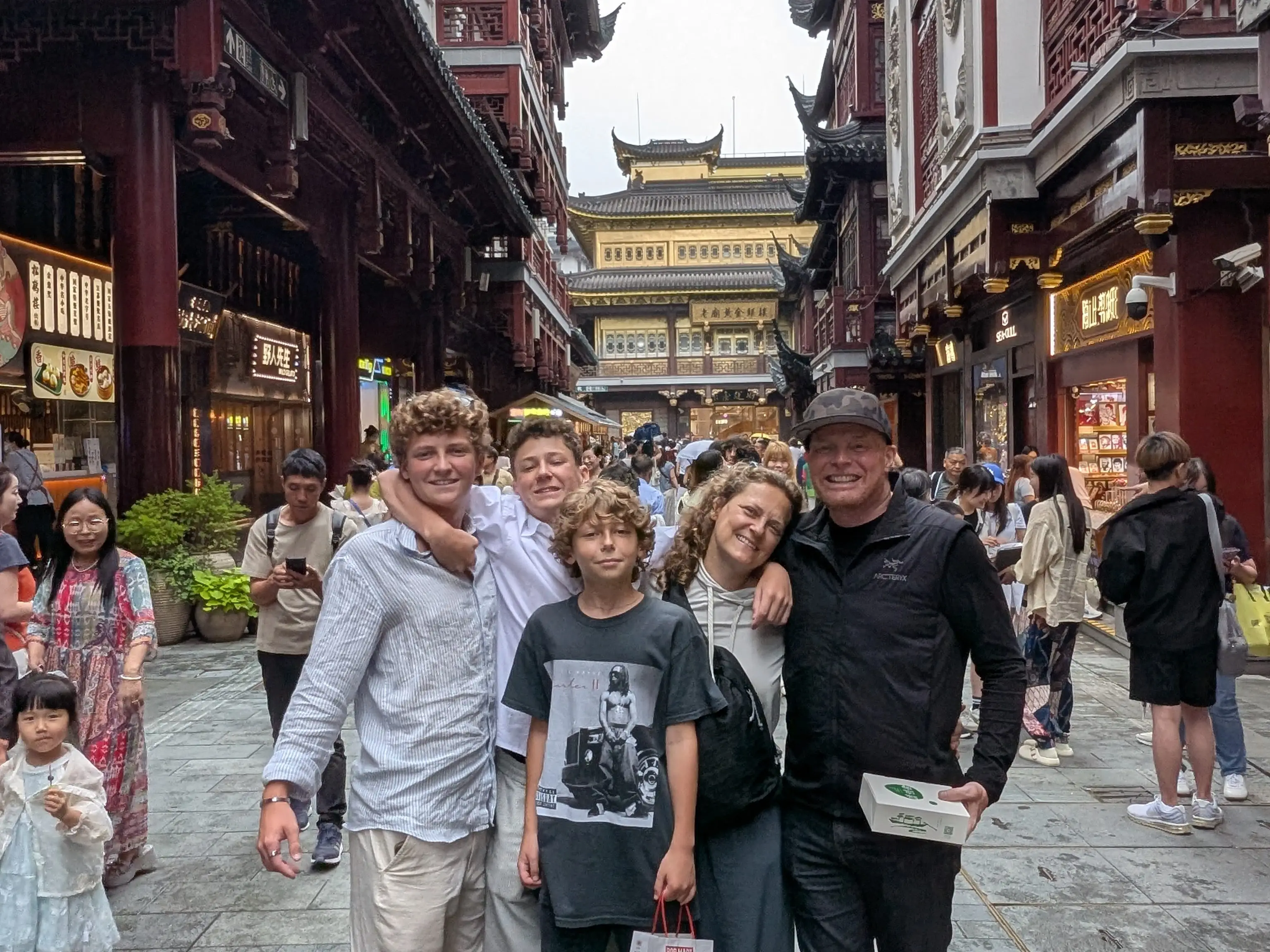 A photo of a family of five on the crowded streets of Shanghai.