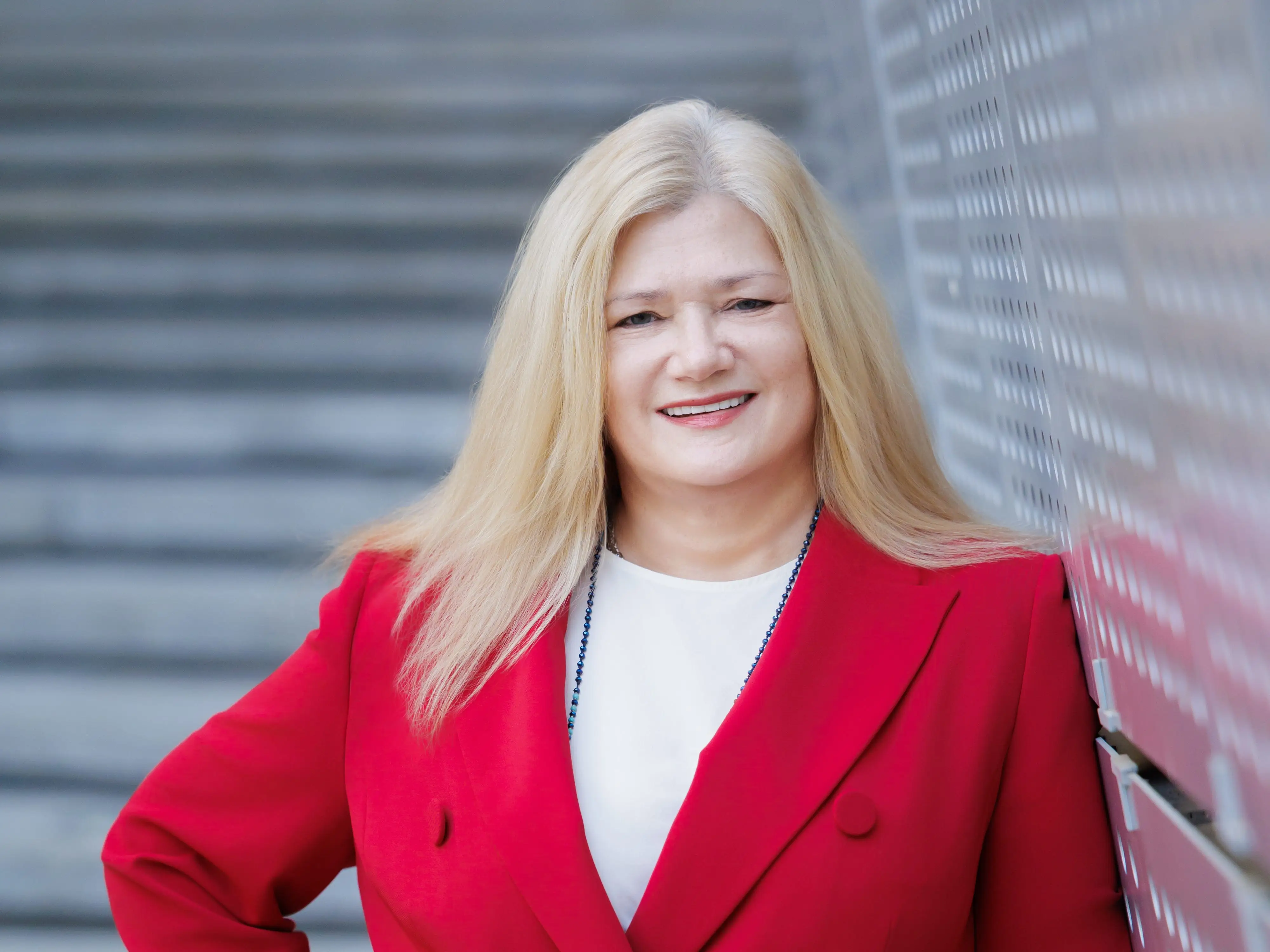 A woman posing in a red suit in South Korea,