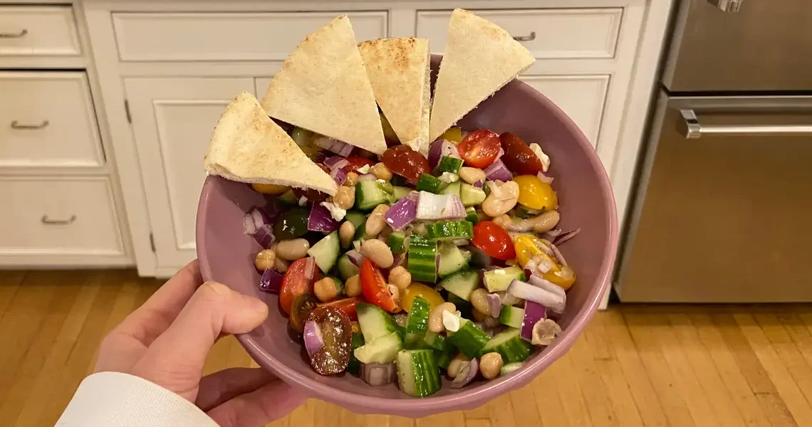 I eat this protein-packed bean salad 3 times a week. It’s cheap, takes 15 minutes to make, and keeps me full for hours.