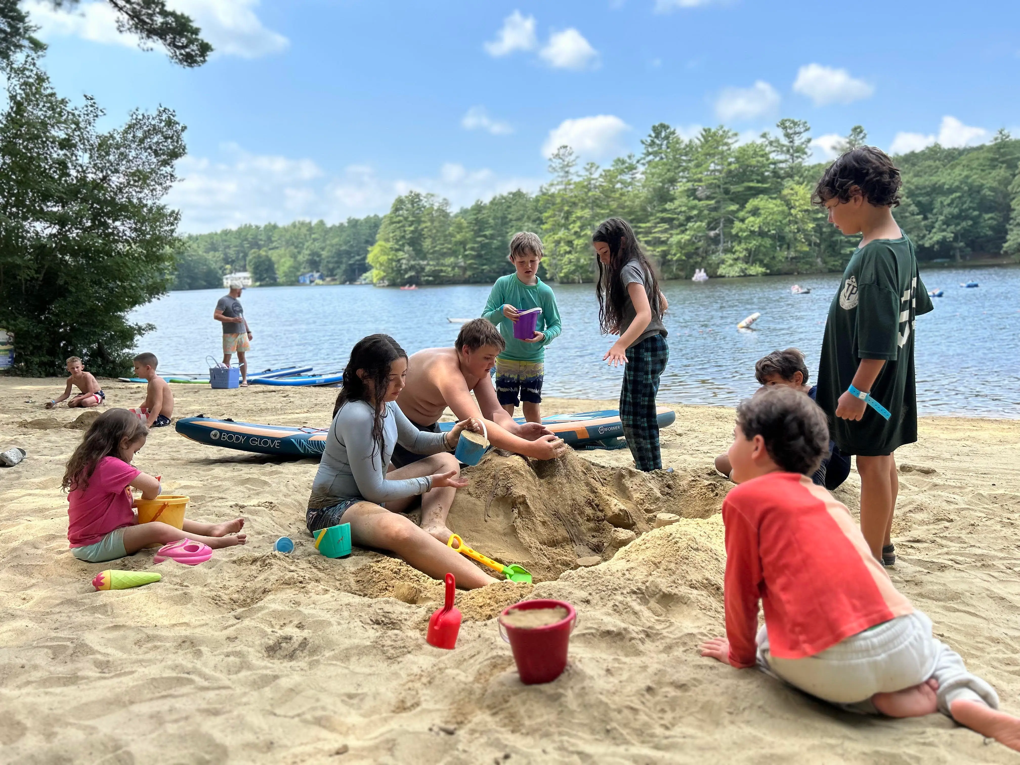 Kids playing in sand.