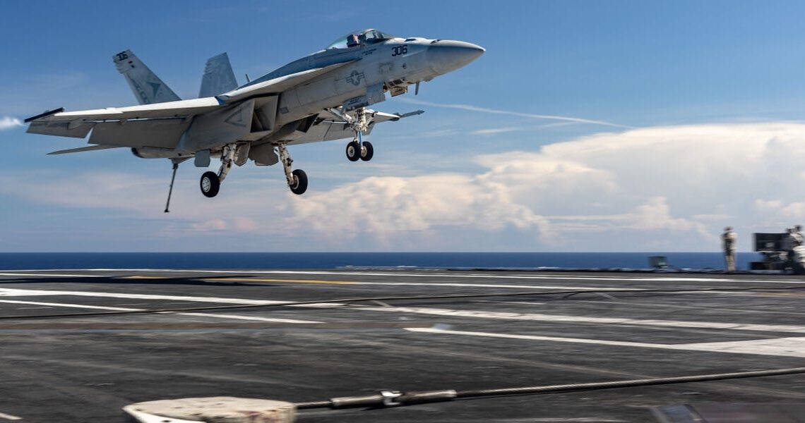 With a boom and sparks, this $60 million Navy jet’s carrier landing unraveled in seconds