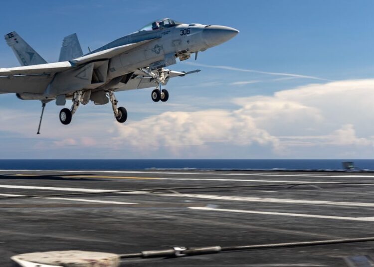 With a boom and sparks, this $60 million Navy jet’s carrier landing unraveled in seconds