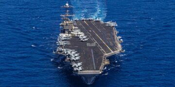 A US aircraft carrier’s hard turn to avoid enemy fire surprised sailors and sent a jet with bad brakes into the sea