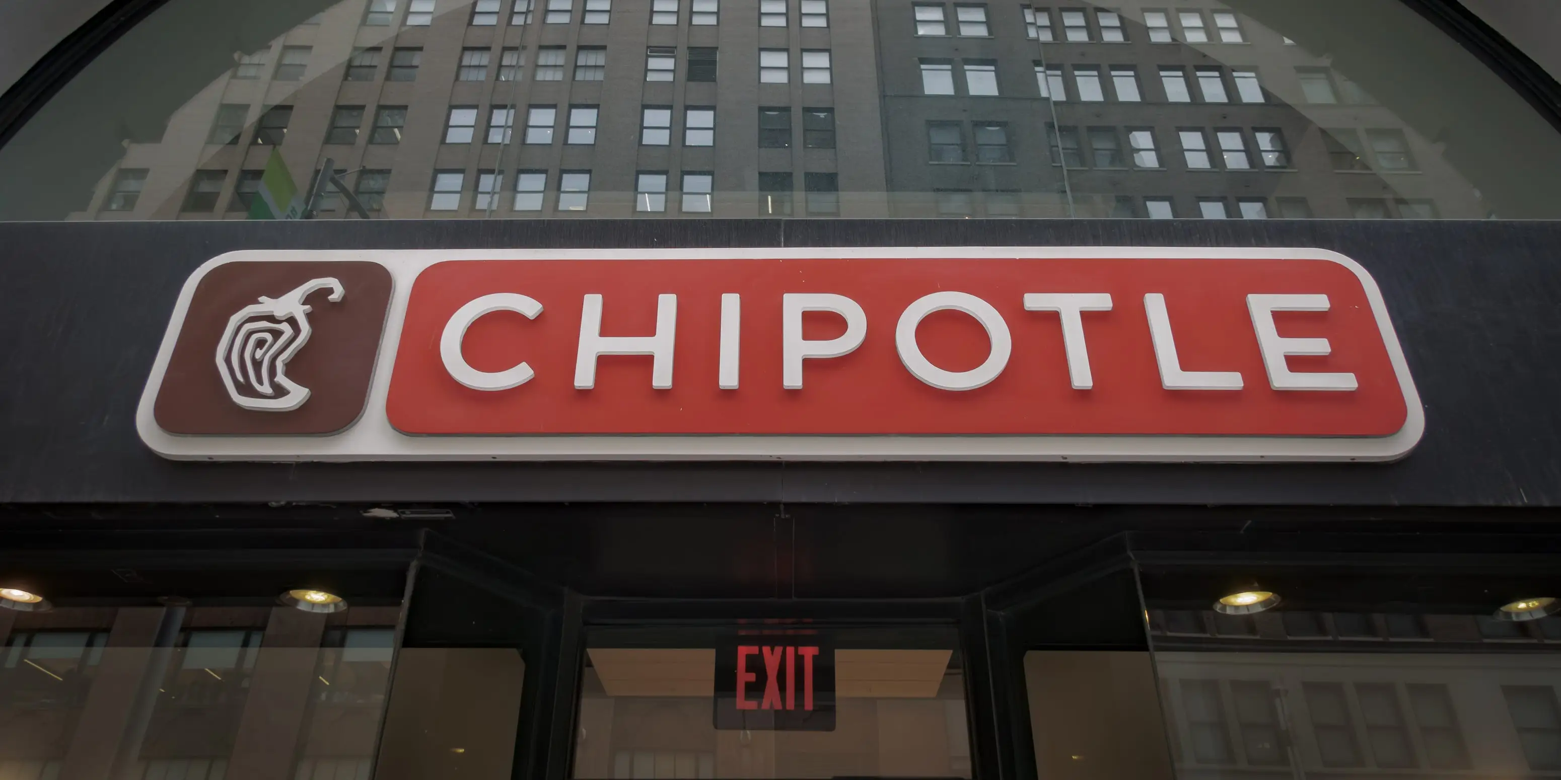 The Chipotle logo is seen on the exterior of an office building
