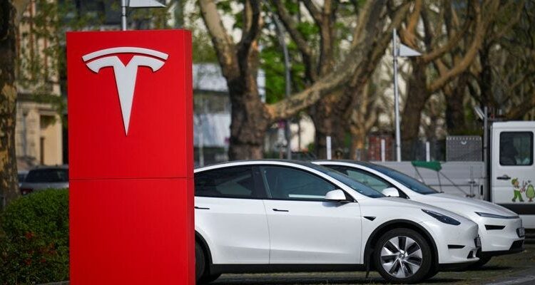 Elon Musk says Tesla FSD will let you use your phone in some cases. Police say don’t do that.