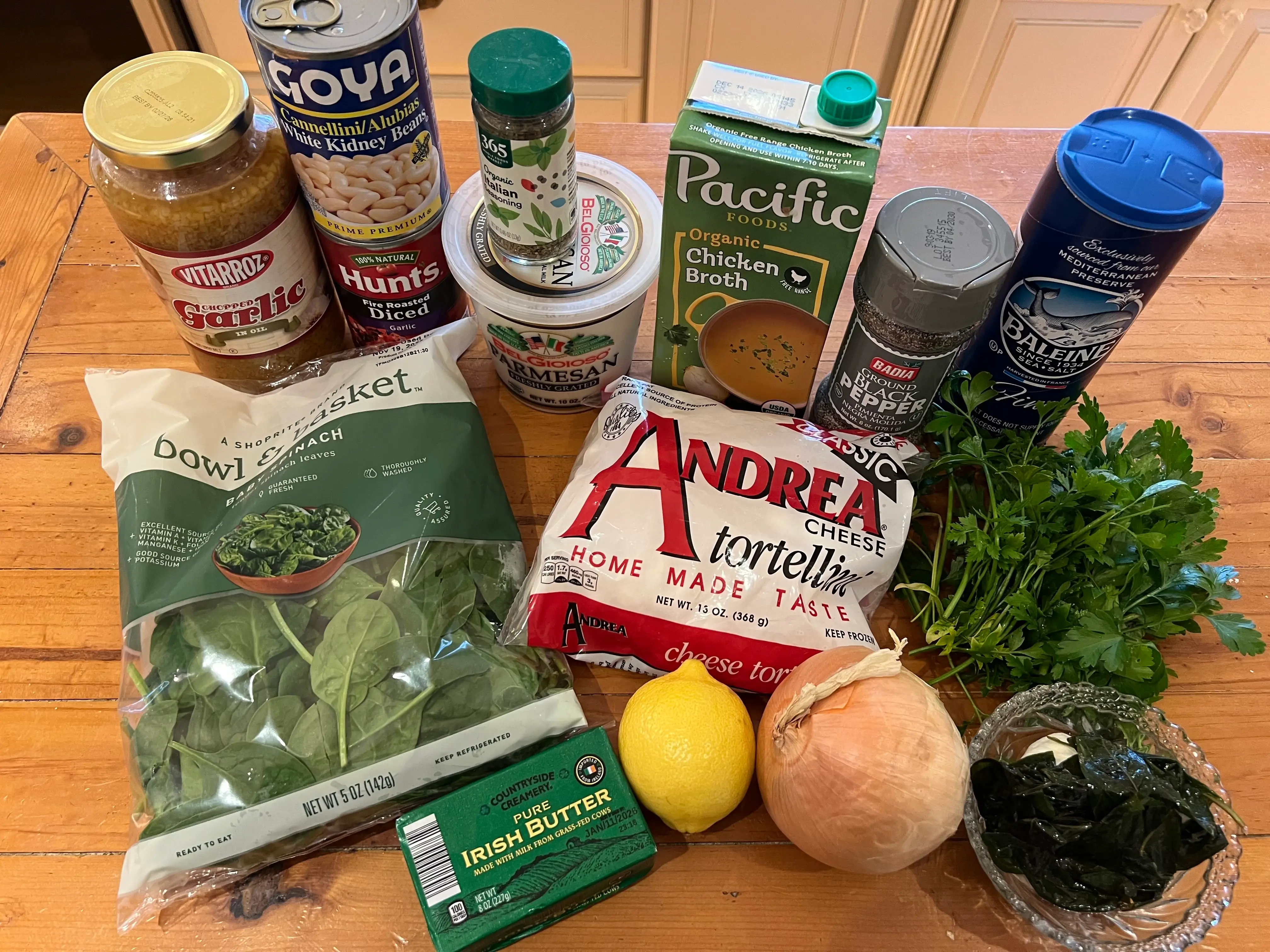 The ingredients for Joanna Gaines' spinach tortellini soup include tortellini, spinach, chicken broth, garlic, onion, lemon, and more.