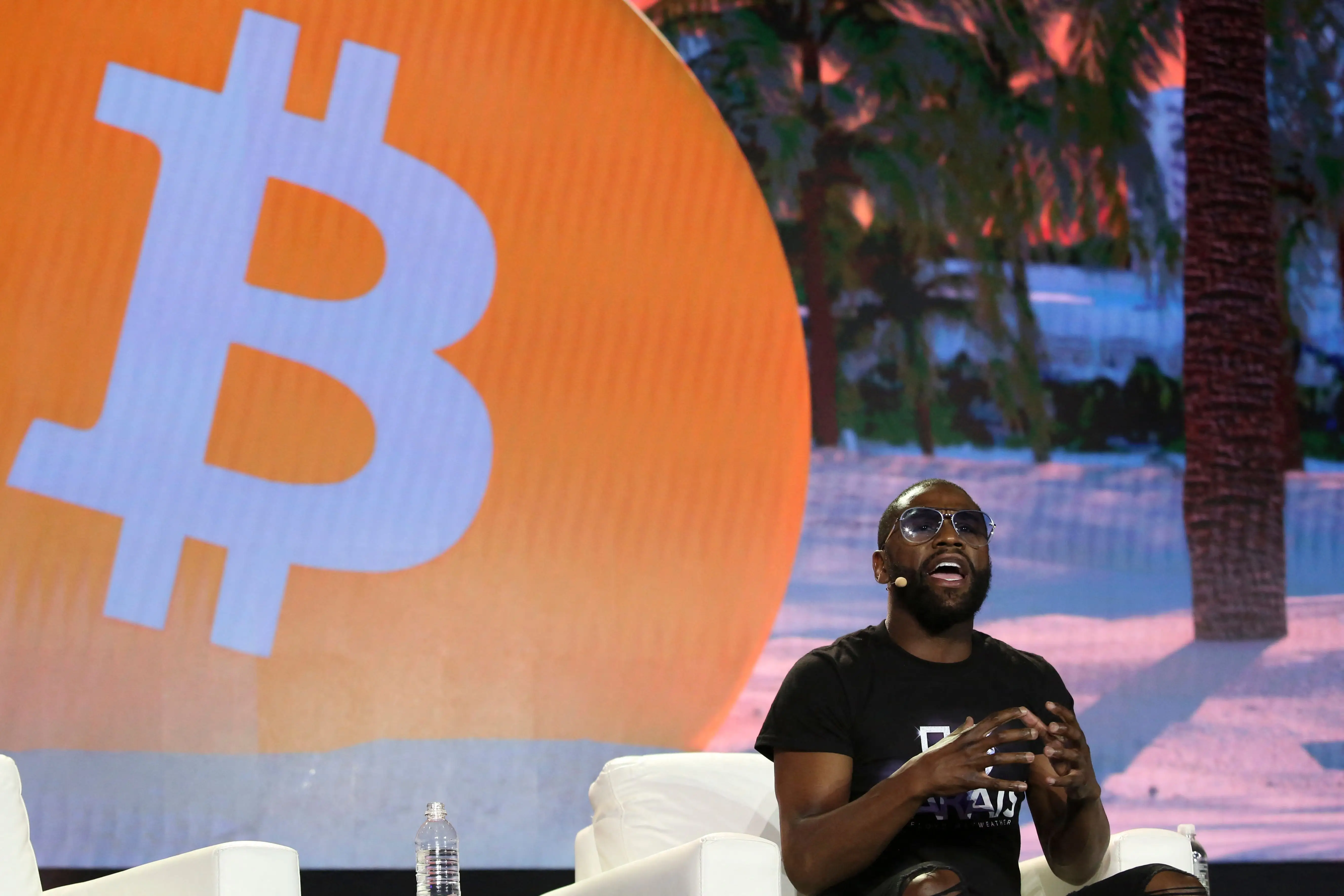 Former world welterweight king Floyd Mayweather speaks on stage during the crypto-currency conference Bitcoin 2021 Convention at the Mana Convention Center in Miami, Florida.