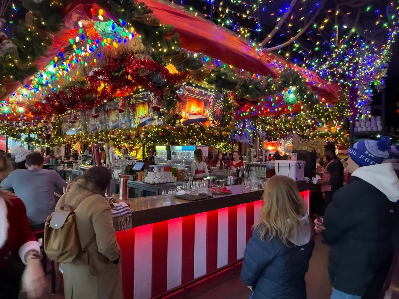 People standing at pop-up holiday bar in Chicago