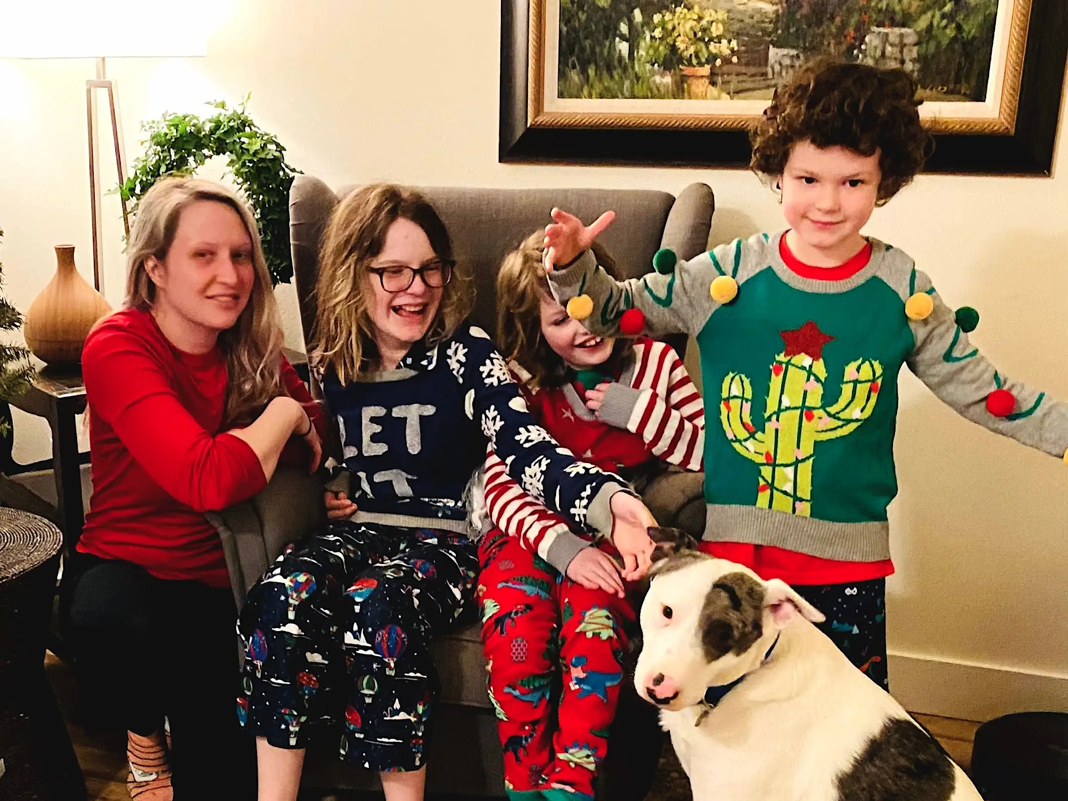 The author with her kids and dog in Christmas pajamas.