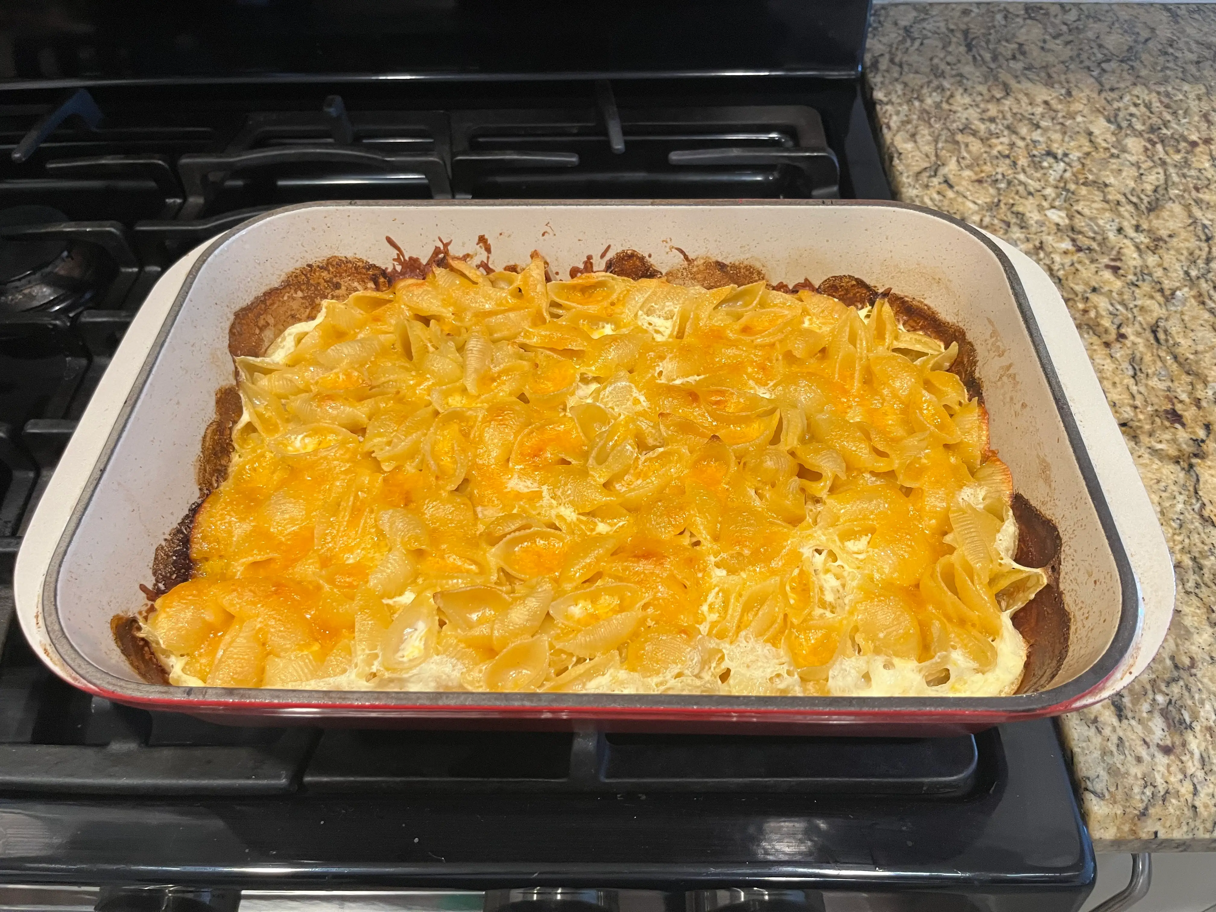 cooked mac and cheese in baking dish after coming out of oven