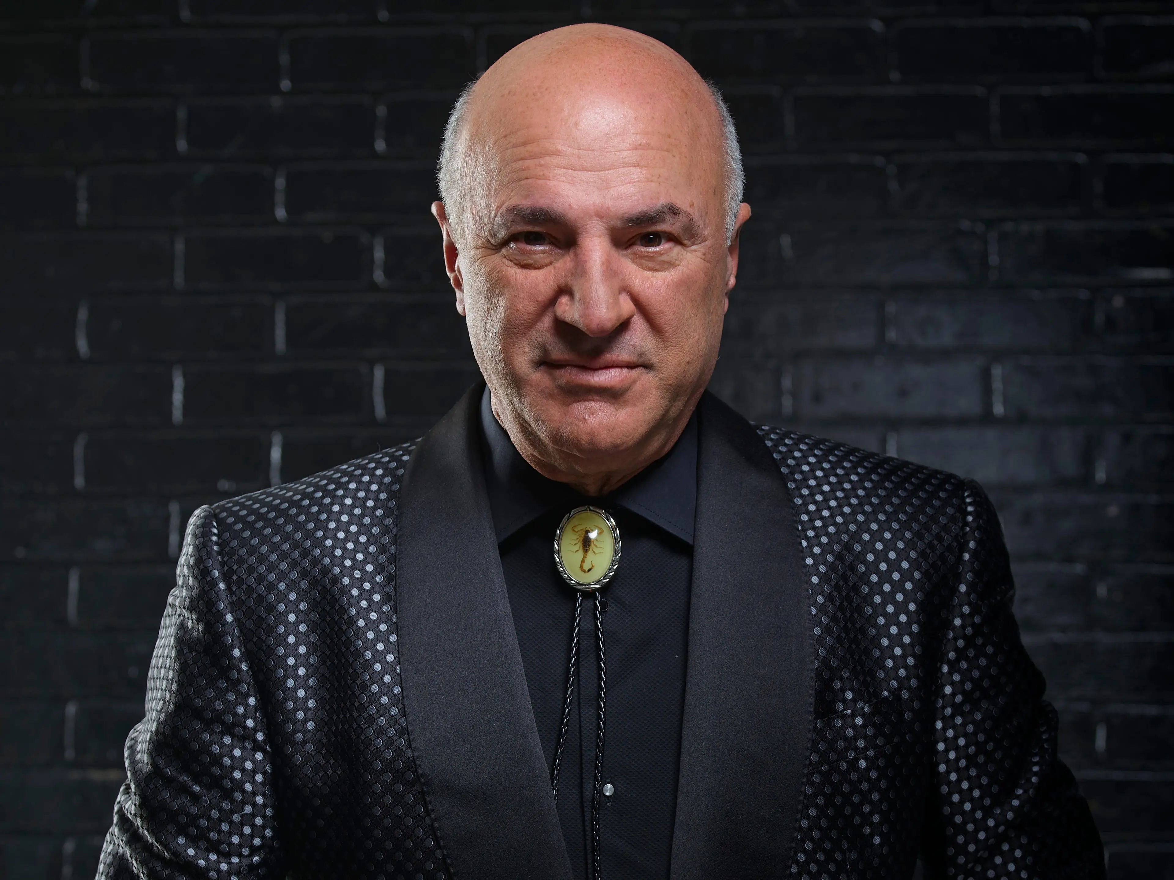 Kevin O'Leary in a dark suit