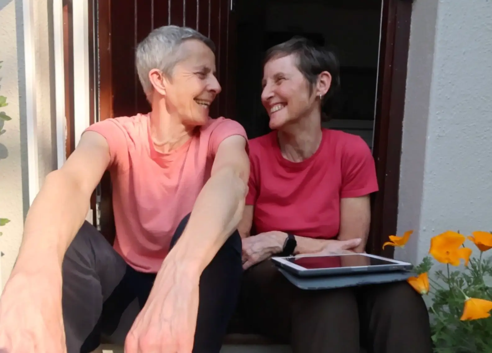 The writer and her wife sitting outside their Cape Town apartment.