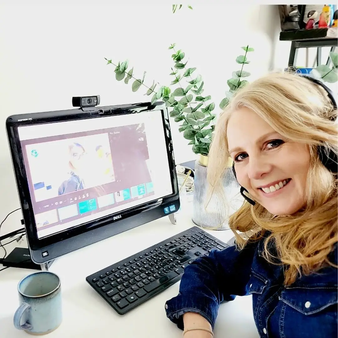 Tracy Gunn sits at her desk, facing the camera.