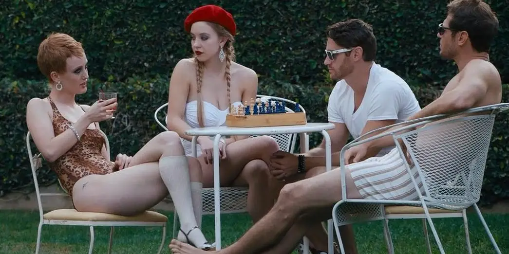 Sydney Sweeney in a red cap