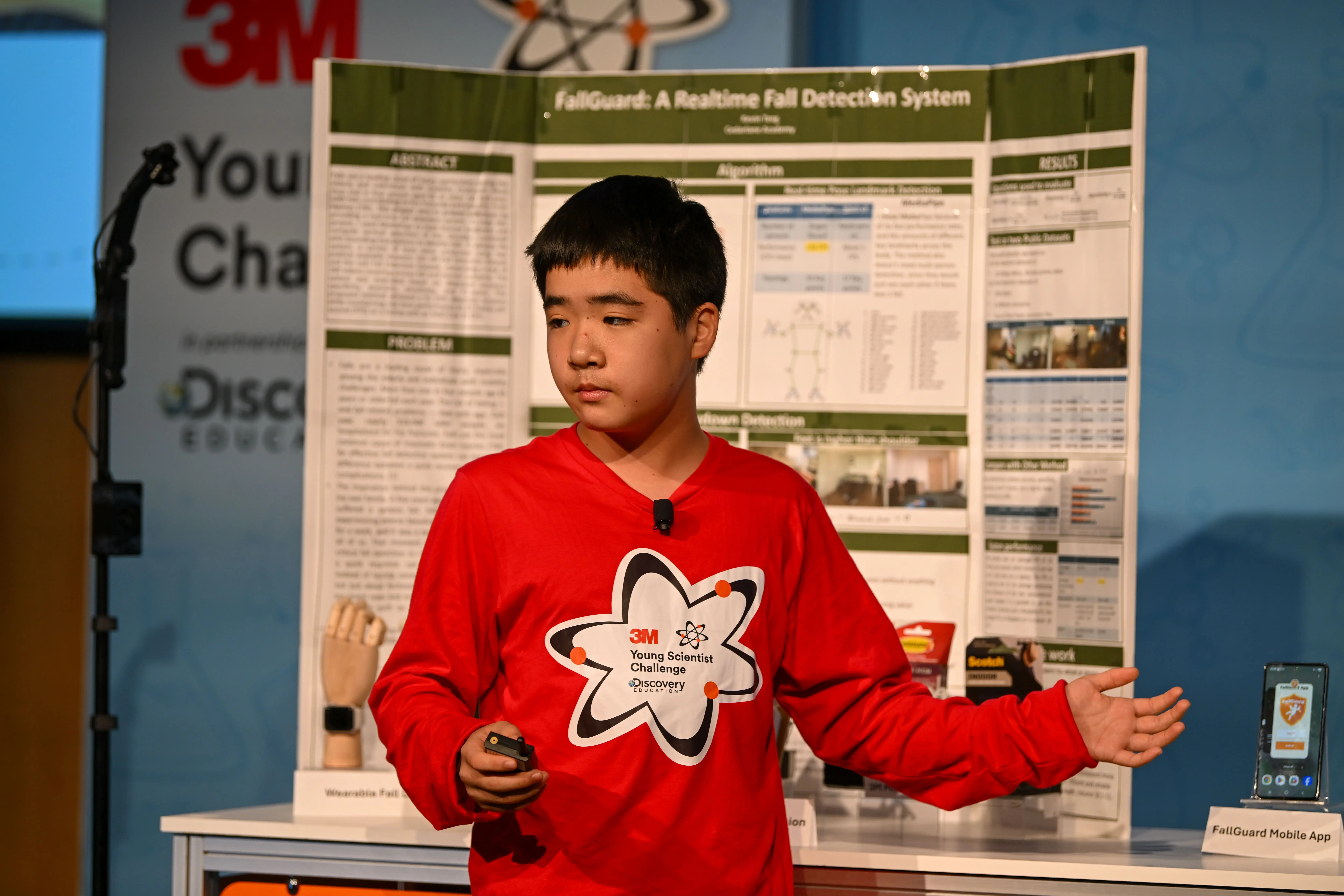 Kevin Tang in front of his science project a 3M Young Scientist Challenge.
