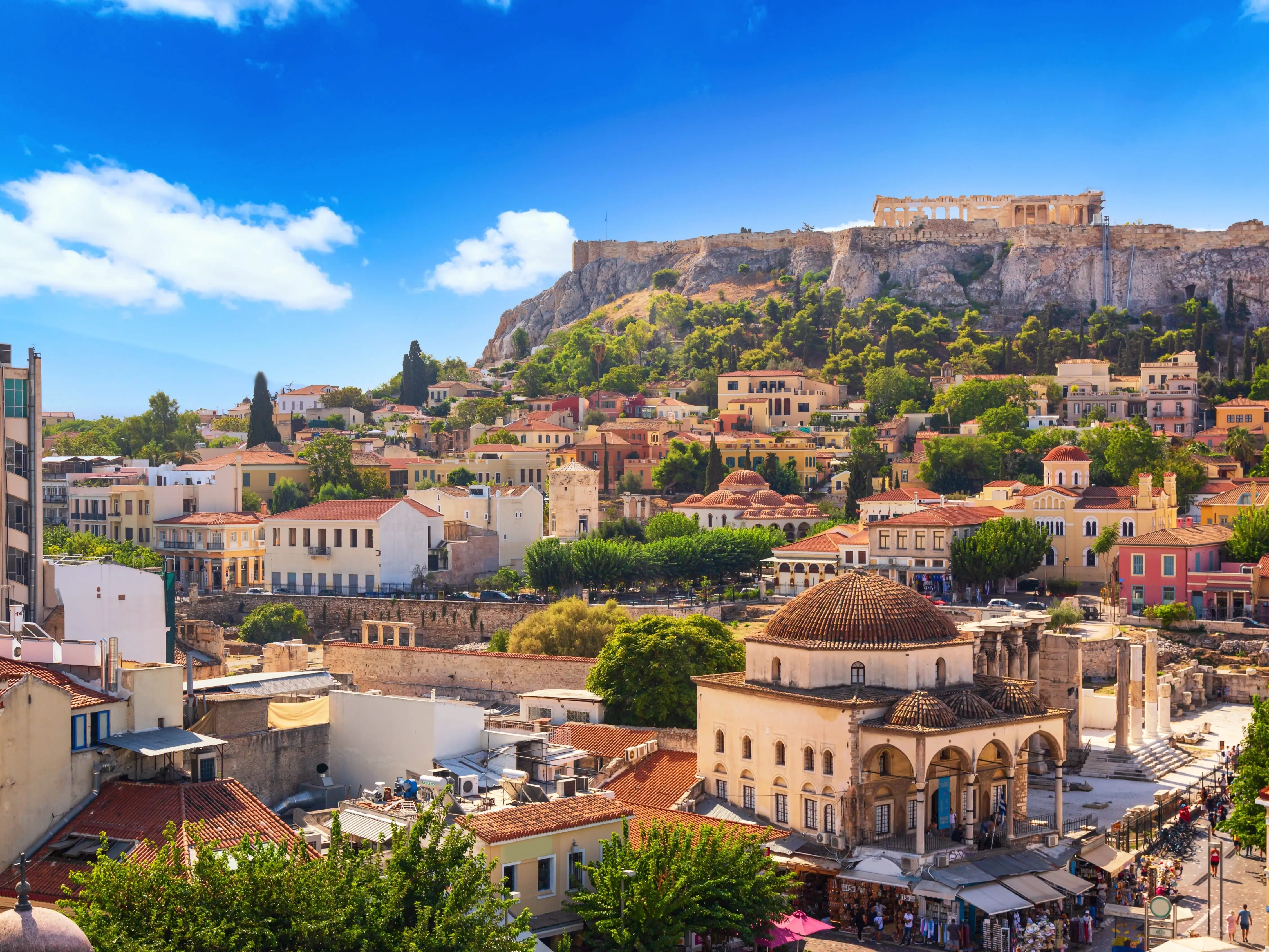 The skyline of Athens with Monastiraki Square and the Acropolis in the frame.