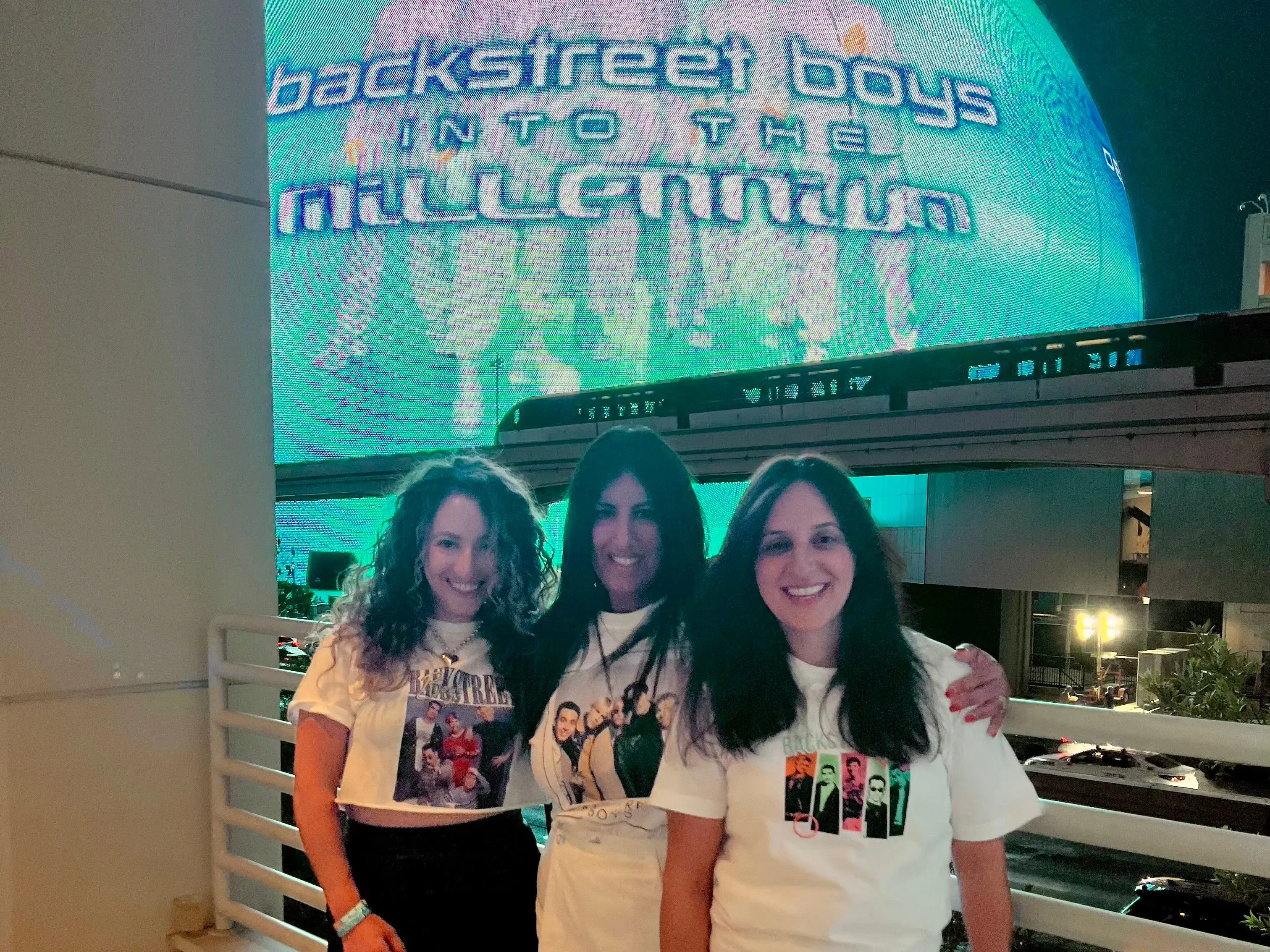 The author poses with two of her friends while at a Backstreet Boys concert at the Sphere in Vegas.