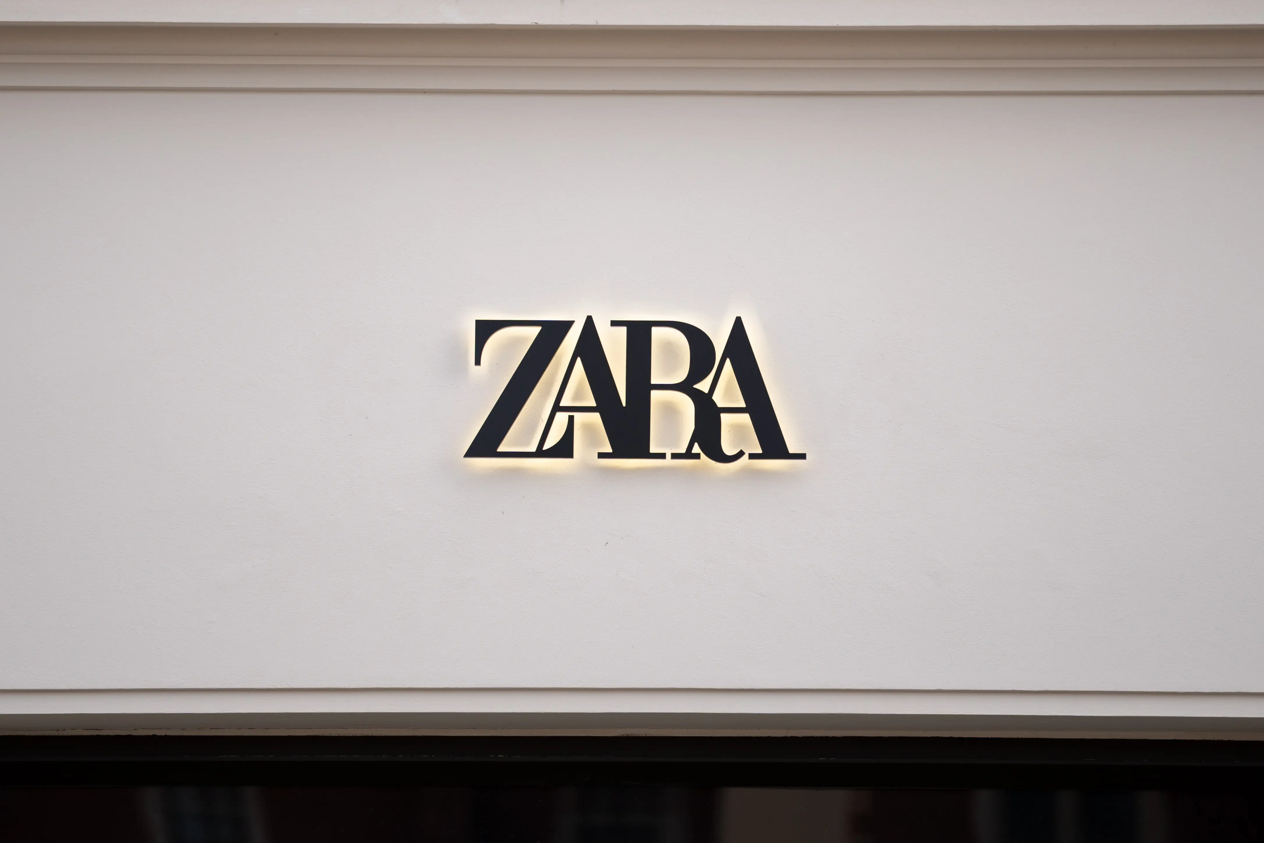 The Zara logo is shown on a storefront.