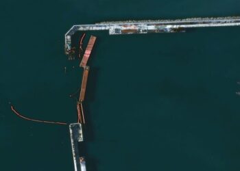Satellite images show Russia fortified a port against Ukrainian drone boats. One broke through underwater and exploded.