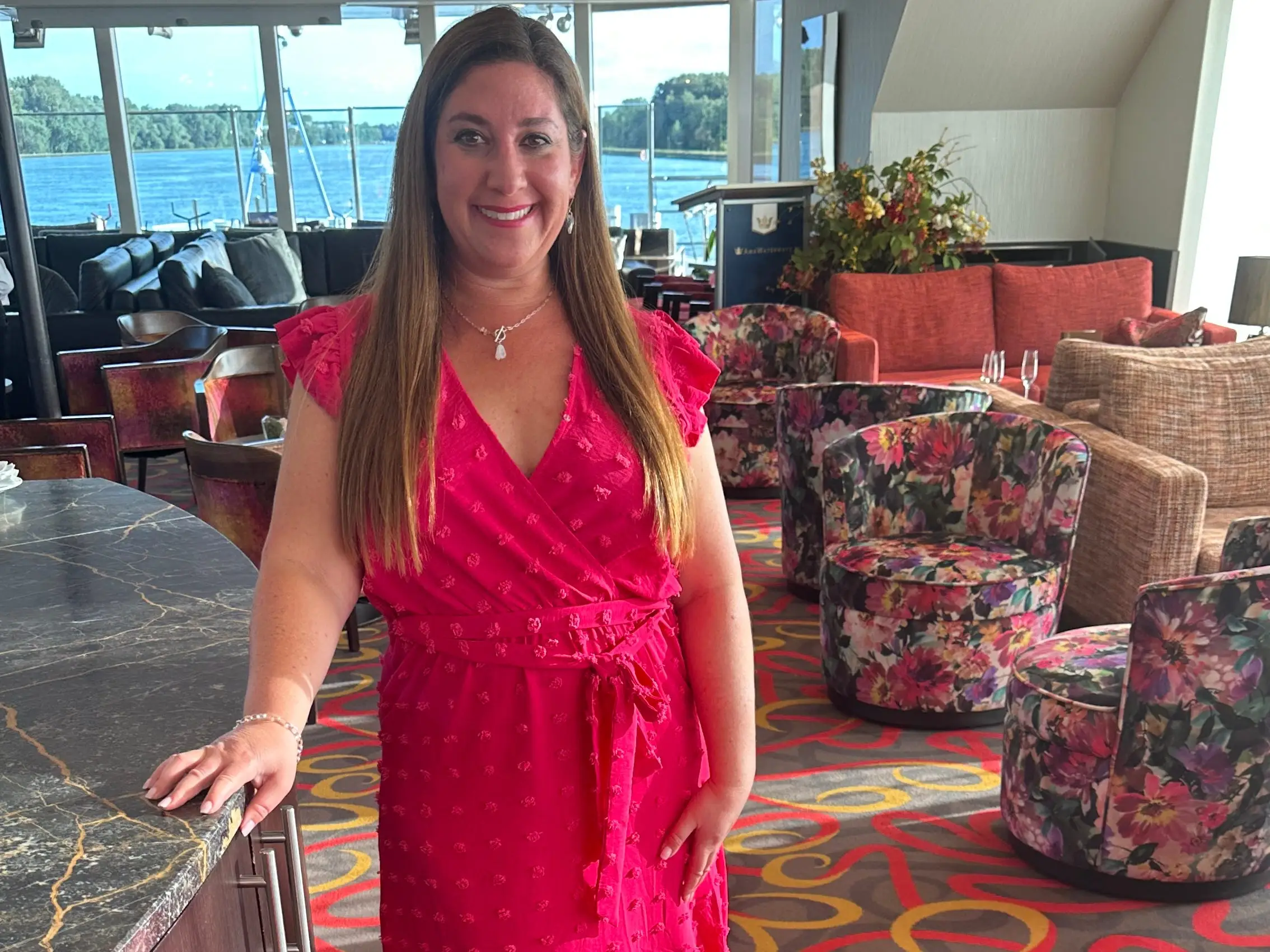 Jill Schildhouse on river cruise ship in pink dress