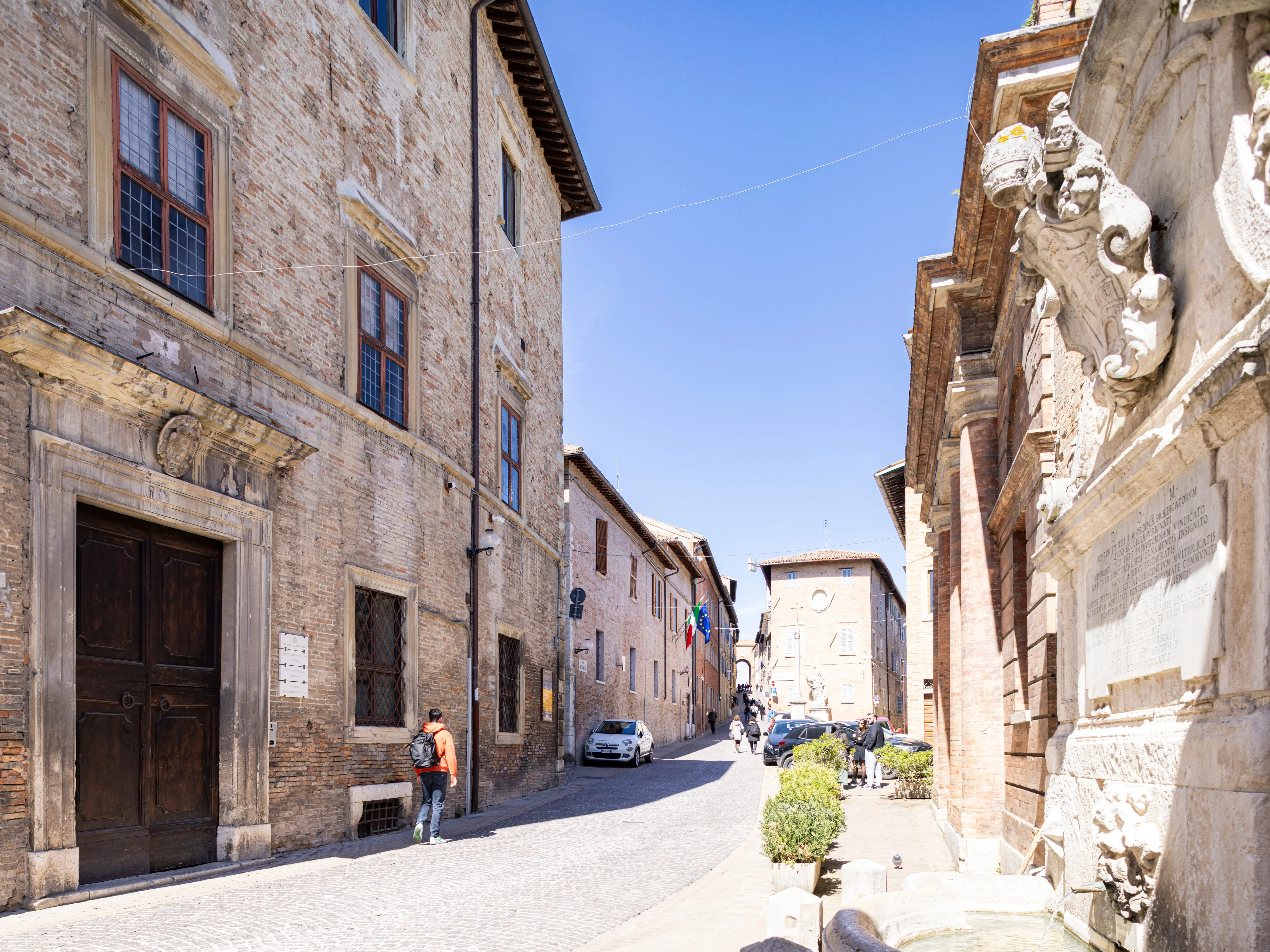 Via Donato Bramante with Palazzo Albani which houses the headquarters of the University of Urbino, the Institute of Art History, the Institute of Archaeology and the Presidencies of Political Sciences and Education Sciences. Urbino (Italy), April 4th, 2024