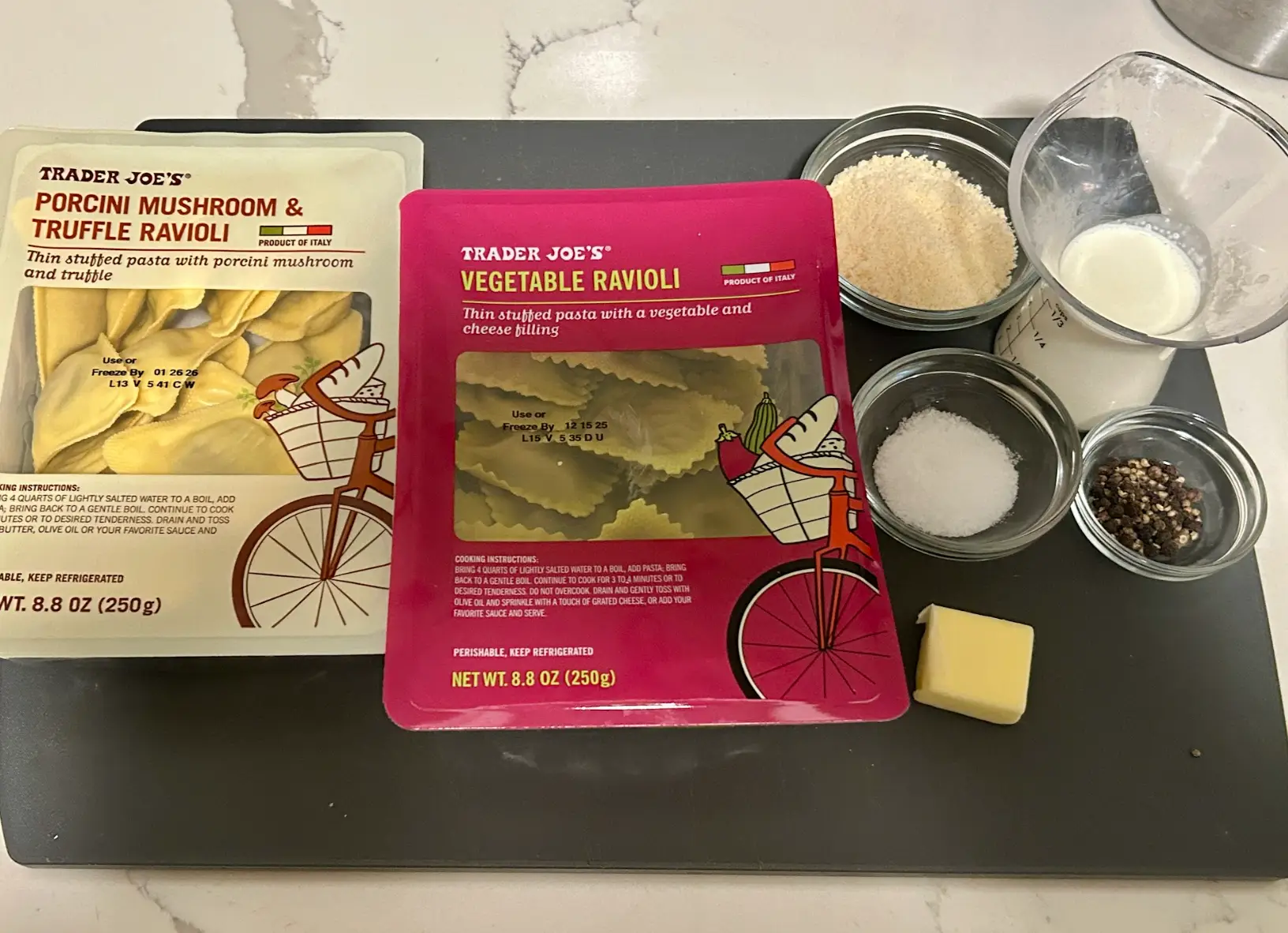 The ingredients for Ree Drummond's cacio e pepe ravioli, including peppercorns and heavy cream.