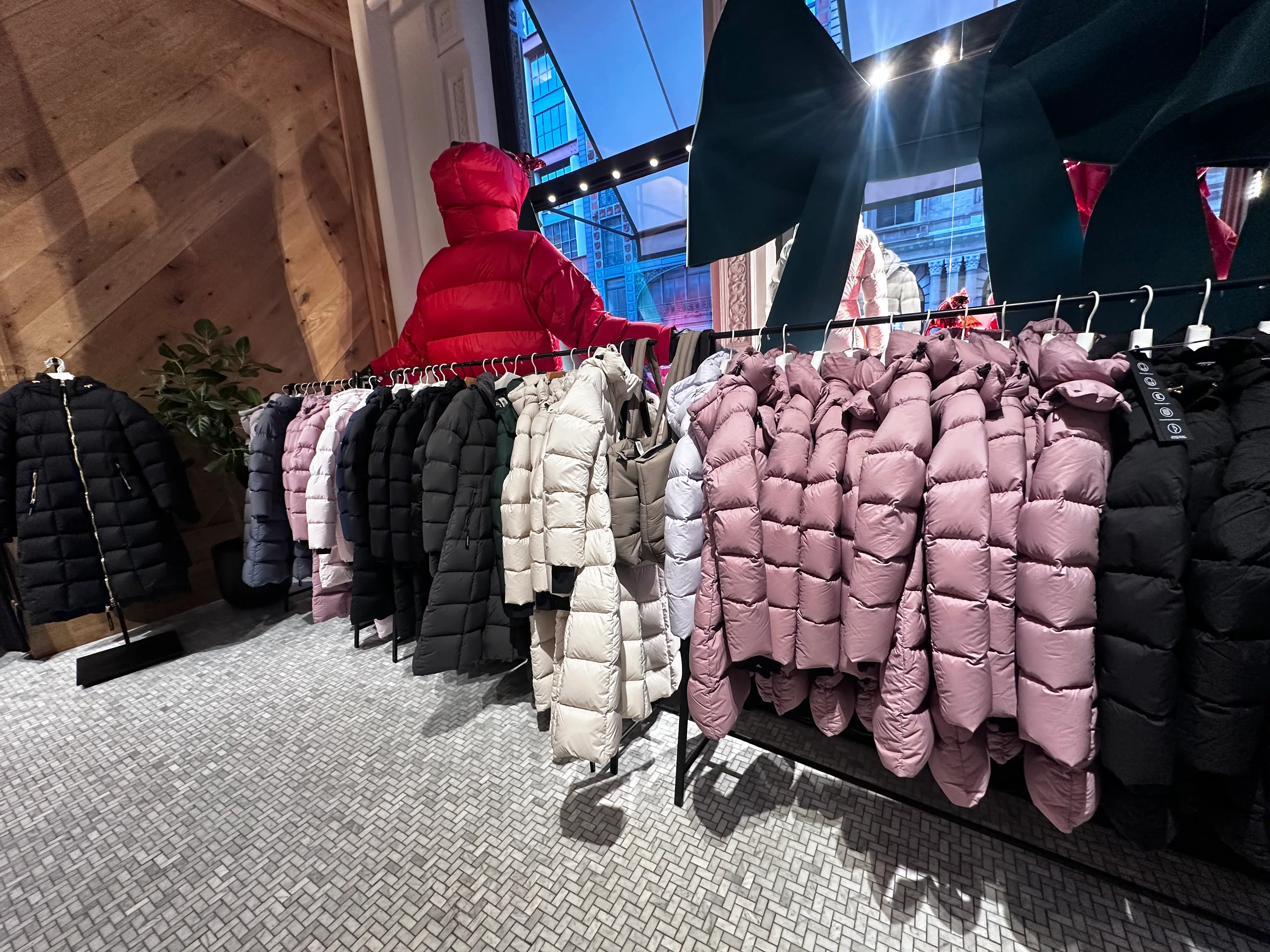 Rack of Super Puff coats at Aritzia