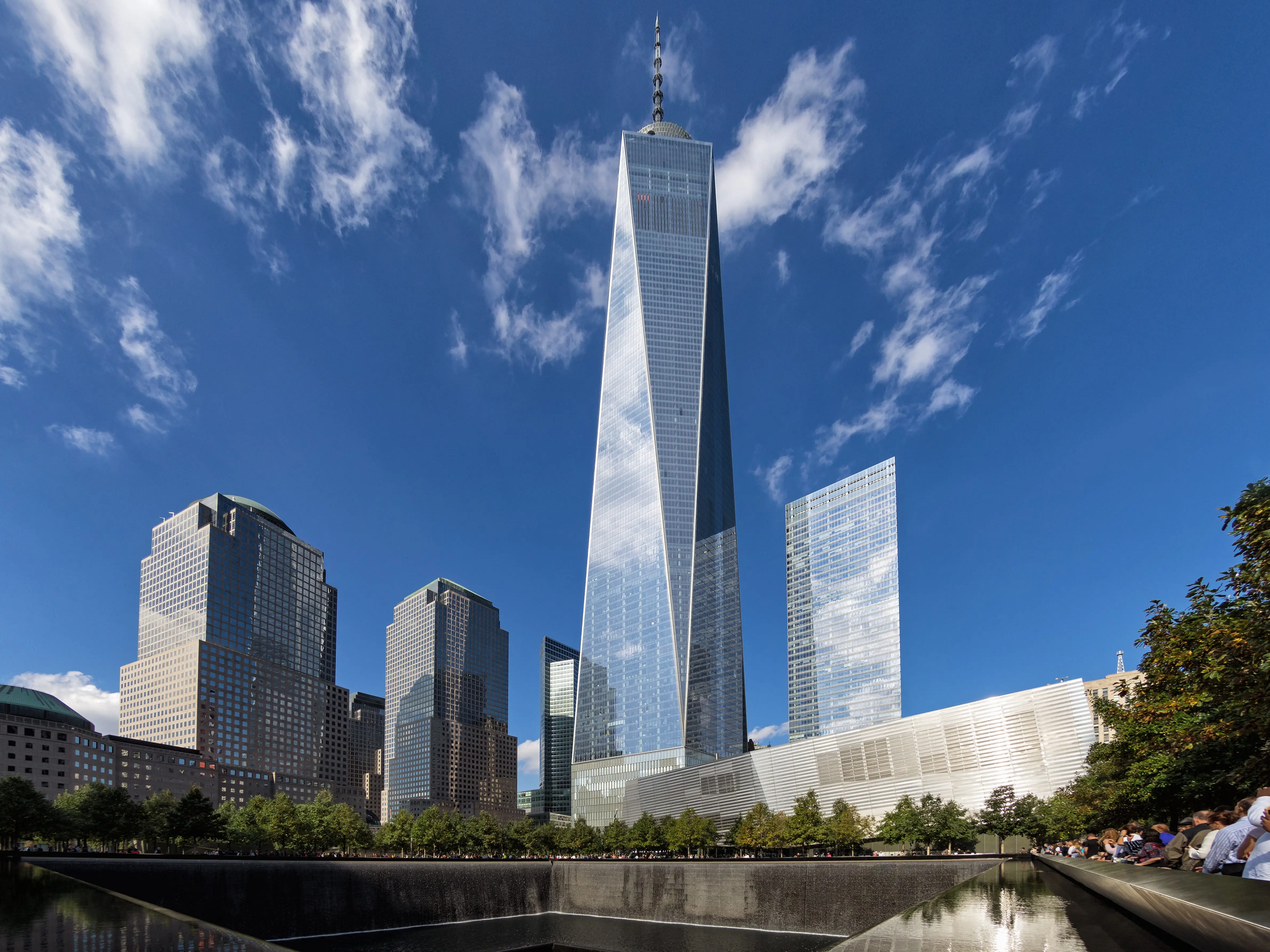 The huge 9/11 Memorial and WTC 1 form an impressive contrast in Lower Manhattan.
