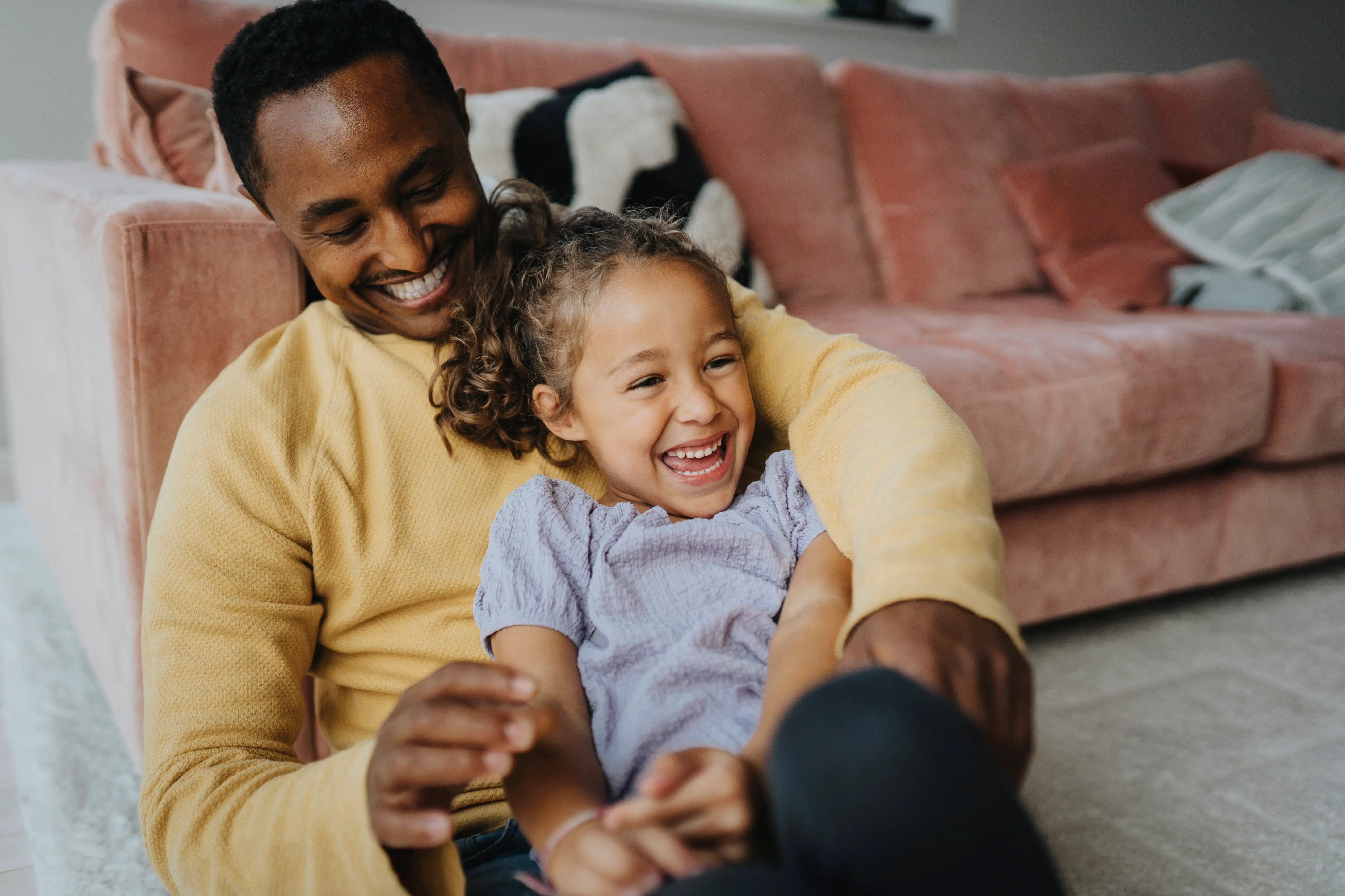 Dad laughing with daughter