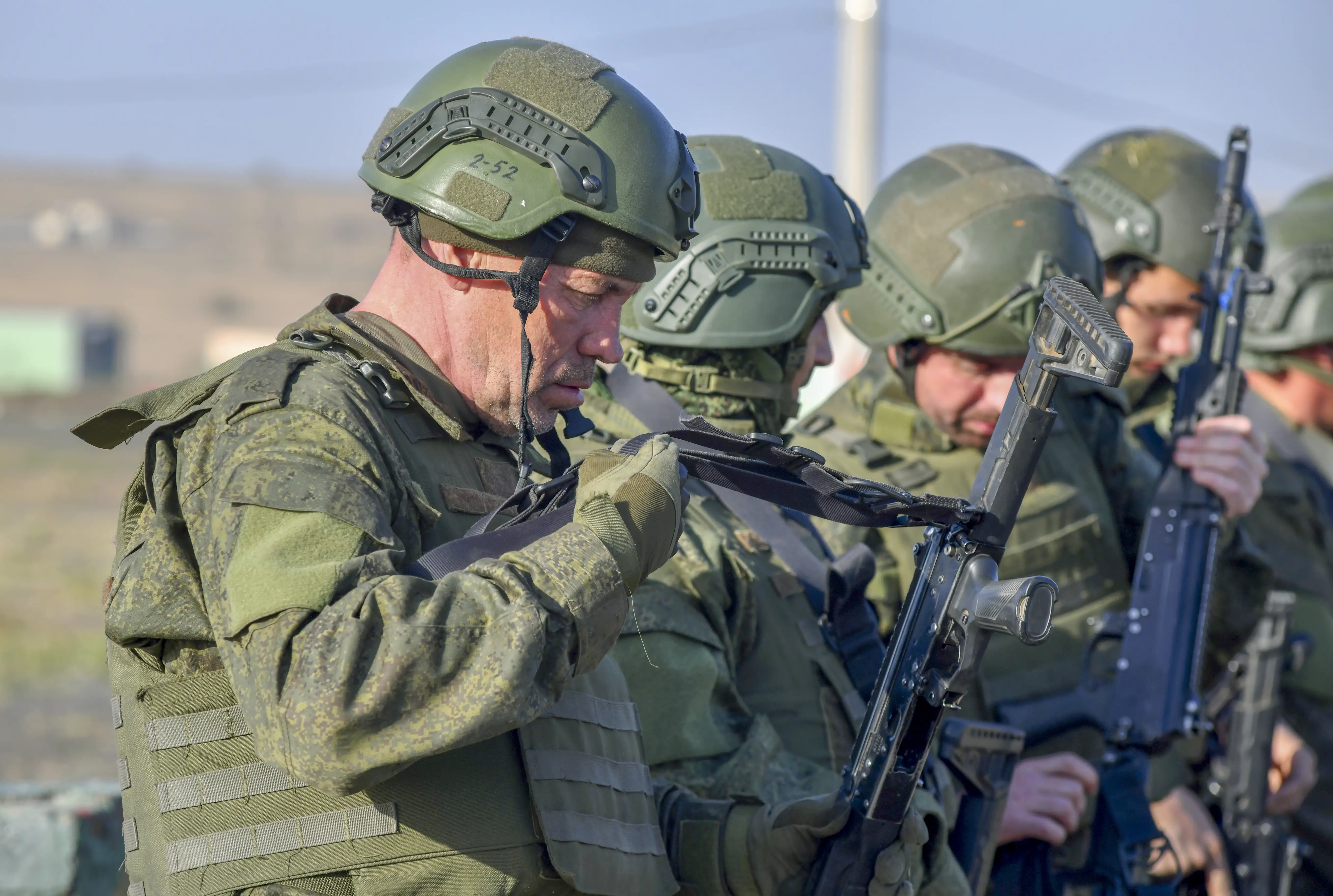 Russian servicemen observe their rifles during military training.